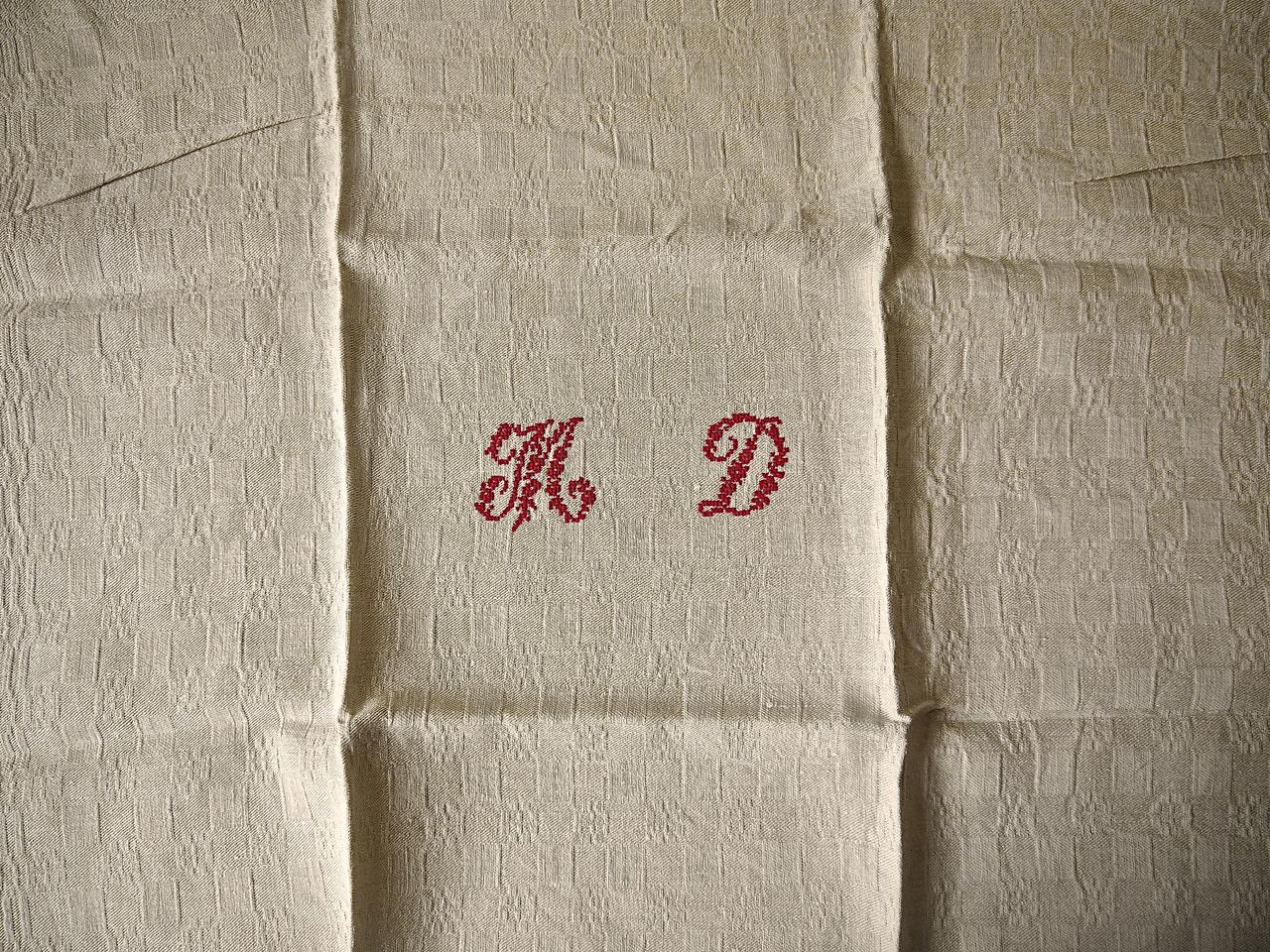 Set of ten late 19th century French napkins monogrammed in red stitching with the letters MD on a heavy natural linen with an interesting weave. In a unused washed perfect condition.