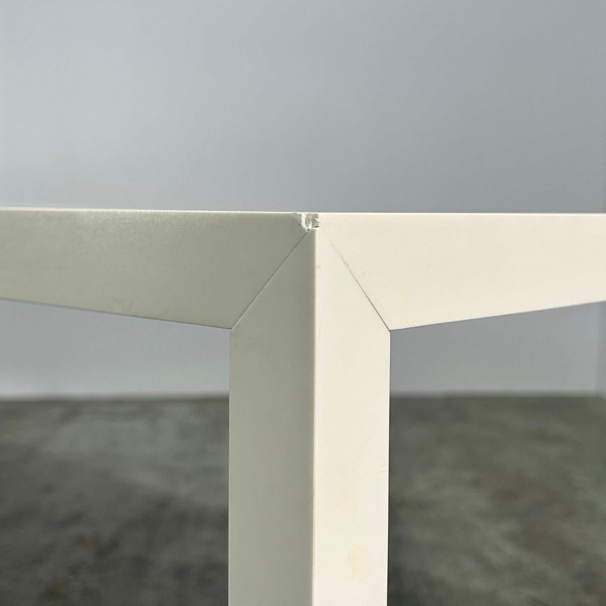 Introducing the MDF Italia Tense Dining Table, a stunning piece designed by Piergiorgio and Michele Cazzaniga. Crafted with precision and attention to detail, this table features a sleek and modern design that will elevate any dining space. The