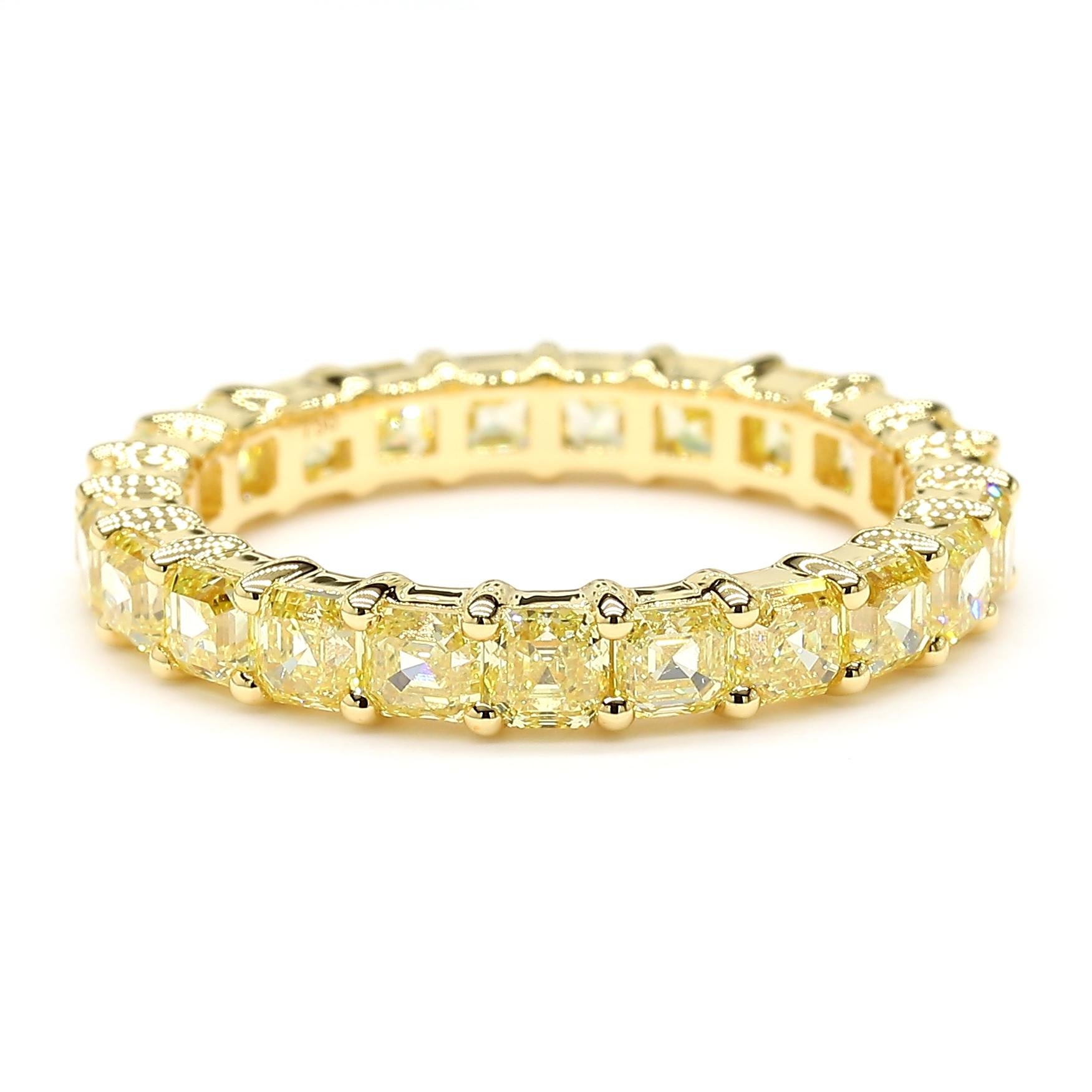 This Fancy Yellow Diamond *Asscher Cut Eternity Ring* is a testament to fine craftsmanship and timeless design. Perfect for those who appreciate the beauty of natural diamonds, this ring offers a balance of luxury and tasteful