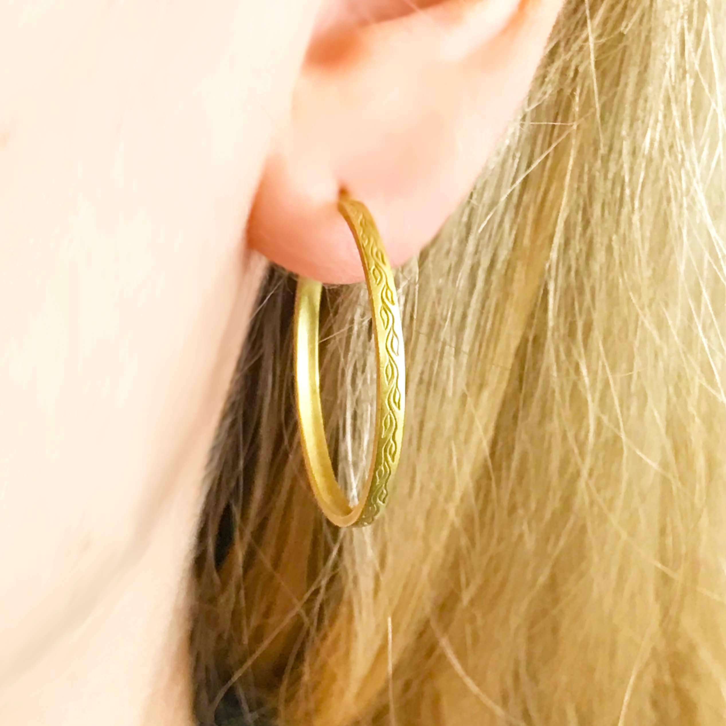 Me & Ro is an iconic name in the jewelry industry and recycles all of their gold and in this case made a beautiful pair of hoop earrings. These are authentic Me & Ro and one of their best selling styles!  You can see the leaf pattern that is a