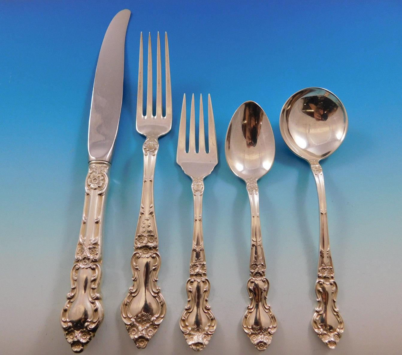 Large dinner size meadow rose by Wallace Sterling silver flatware set - 95 pieces. This set includes:

18 dinner size knives, 9 5/8