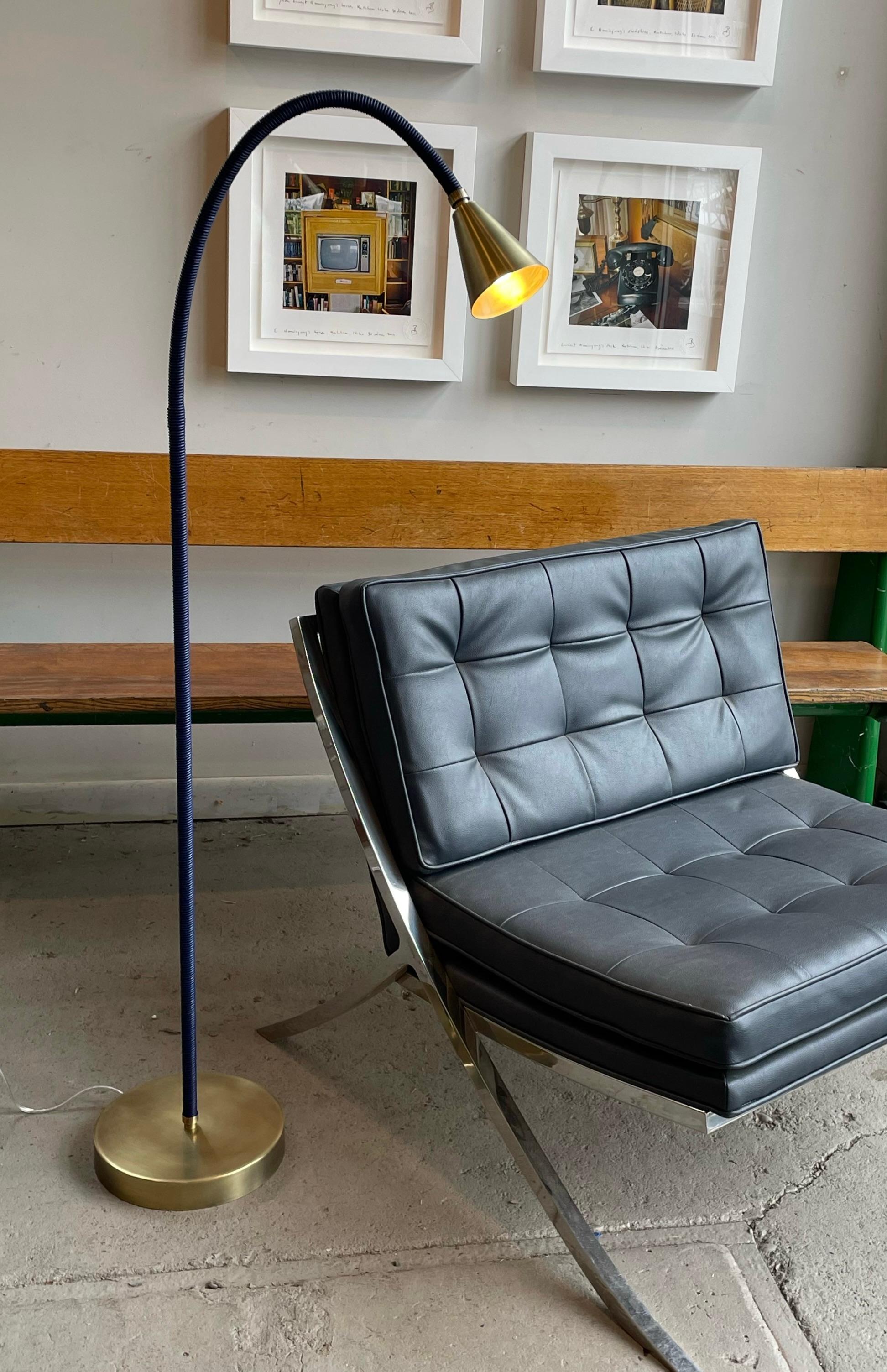 Meander Floor Lamp, with one leather wrapped flex arm. 
Sculptural, textural, colorful, flexible floor lamp. Shine a light on your favorite reading material or pose as you wish to add flair to any room.
Choose from over 25 leather colors and 5
