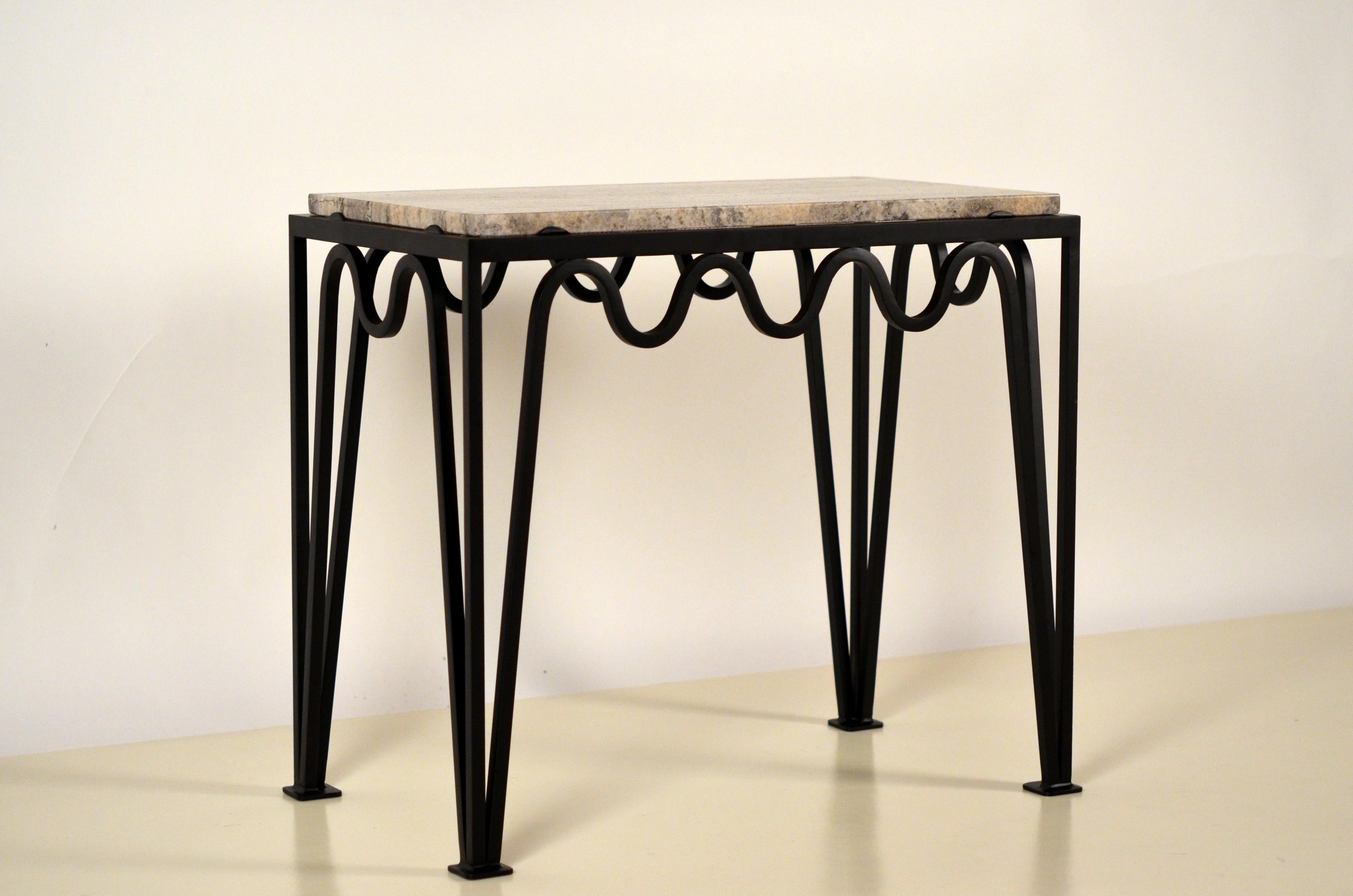 'Méandre' black iron and silver travertine side table by Design Frères.

Chic and understated.