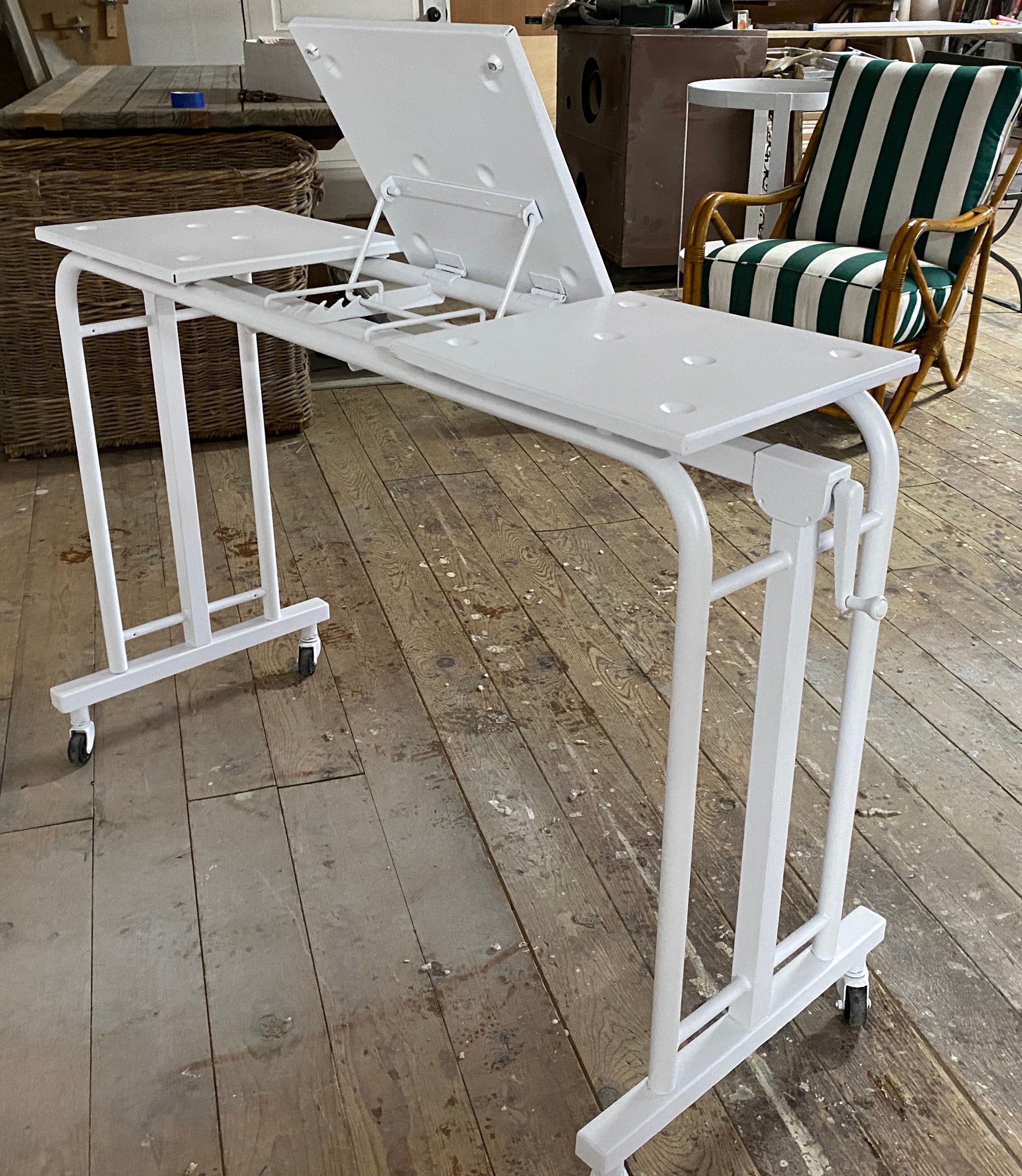 A rare arc deco style hospital overbed table. This table is multifunctional. Use it for mobile laptop cart, computer or a rolling desk dart. Or use it for its original purpose, a hospital bed table for someone who is convalescing. Also great as a