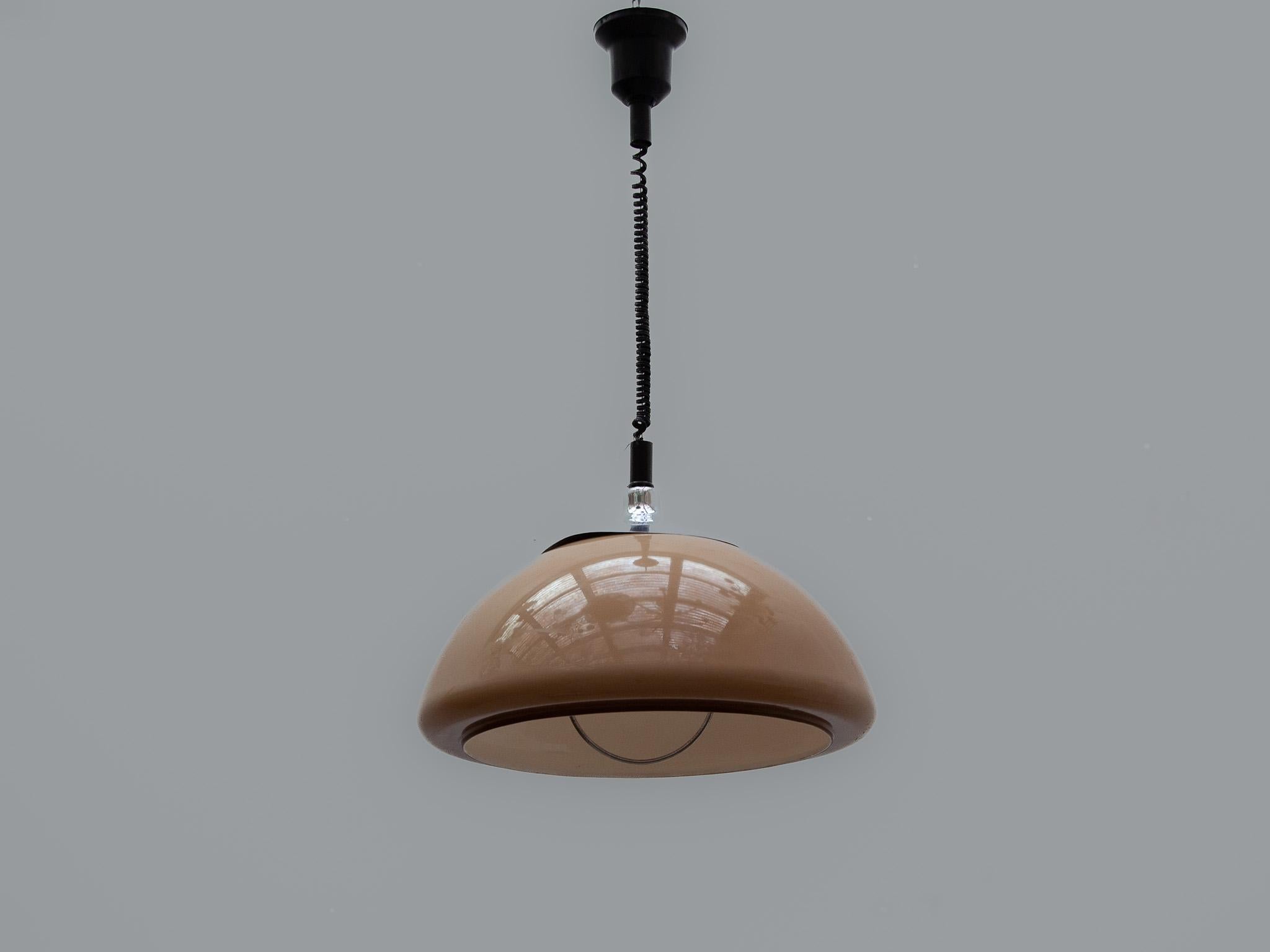 Harvey Guzzini chandelier in caramel/brown coloring, with an acrylic dome shape and original black acrylic canopy. The underside of the dome with chrome surround. Emits a beautiful warm light. Great statement piece and highly indicative of the