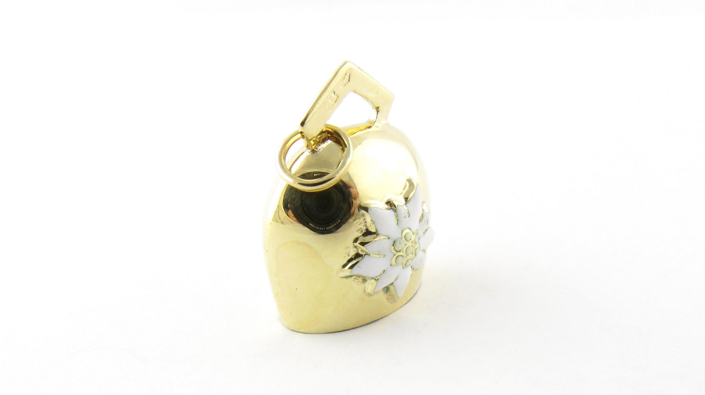 Vintage Mechanical 14 Karat Yellow Gold Bell with Edelweiss Flower Charm- 
This 3D charm features a miniature ringing bell detailed with a lovely enamel edelweiss flower. Meticulously crafted in 14K yellow gold. 
Size: 20 mm x 17 mm (actual charm)