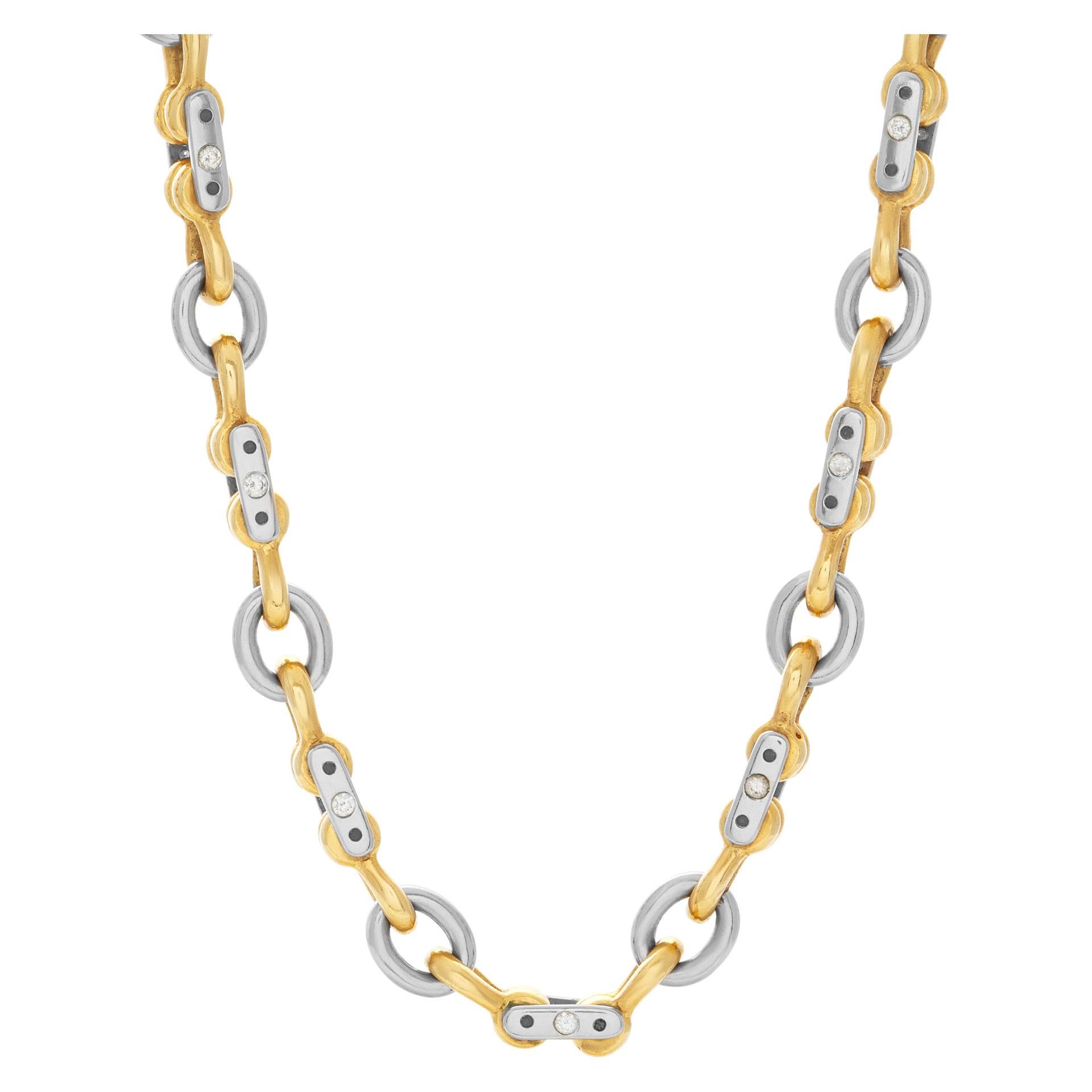 Mechanical link 18k white & yellow gold chain with approximately 1.32 carat in G-H color, VS clarity diamond accents (each diamond 0.03 carat 44 stones). Length 22 inches. Width 6.5mm.
