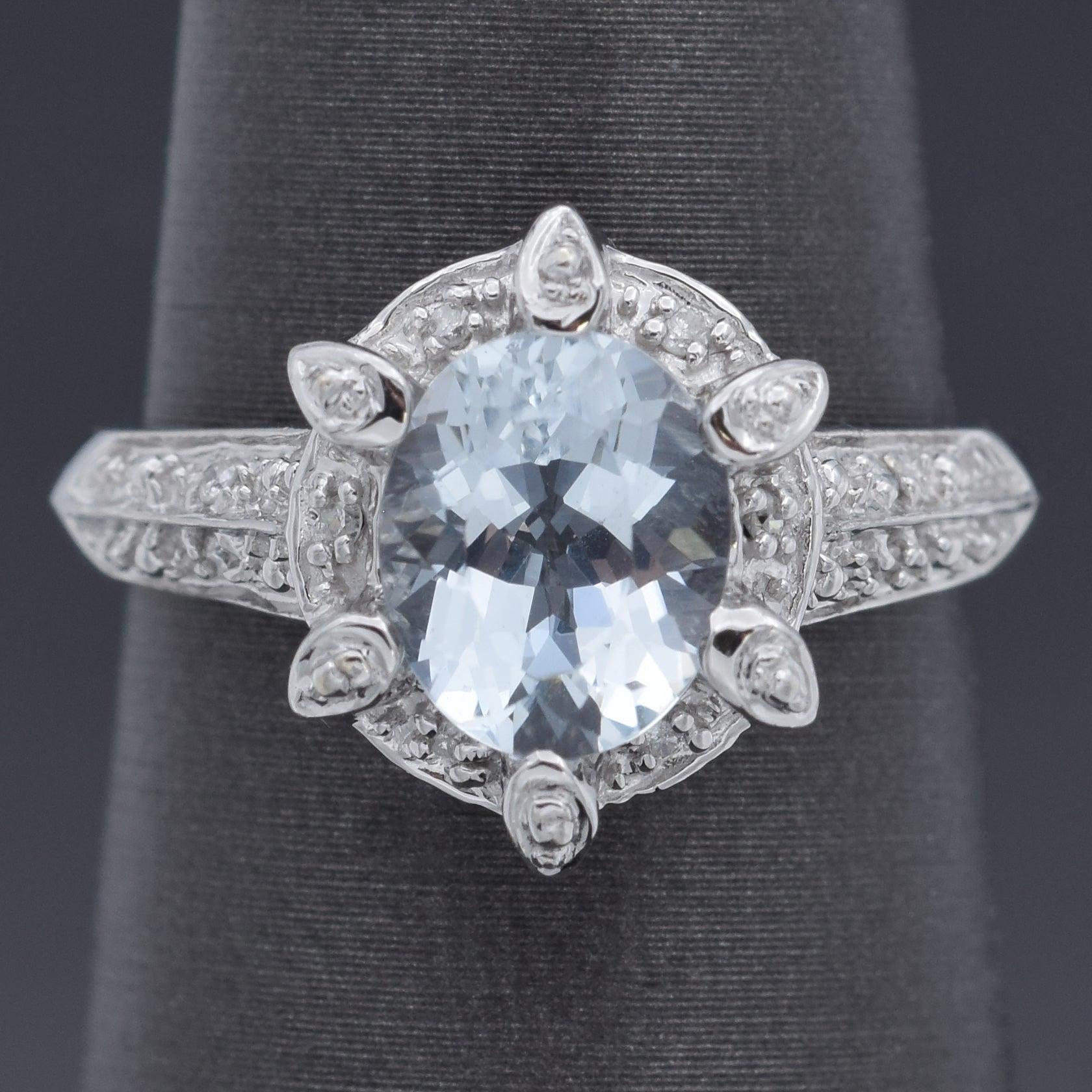 This stunning 14k white gold ring features a captivating oval cut aquamarine weighing 1.33cts. The stone exhibits a mesmerizing light blue hue with exceptional clarity. The intricate setting enhances the brilliance of the aquamarine, allowing light