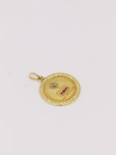 Médaille amour Augis ronde en or, diamants et rubis ca. 1910