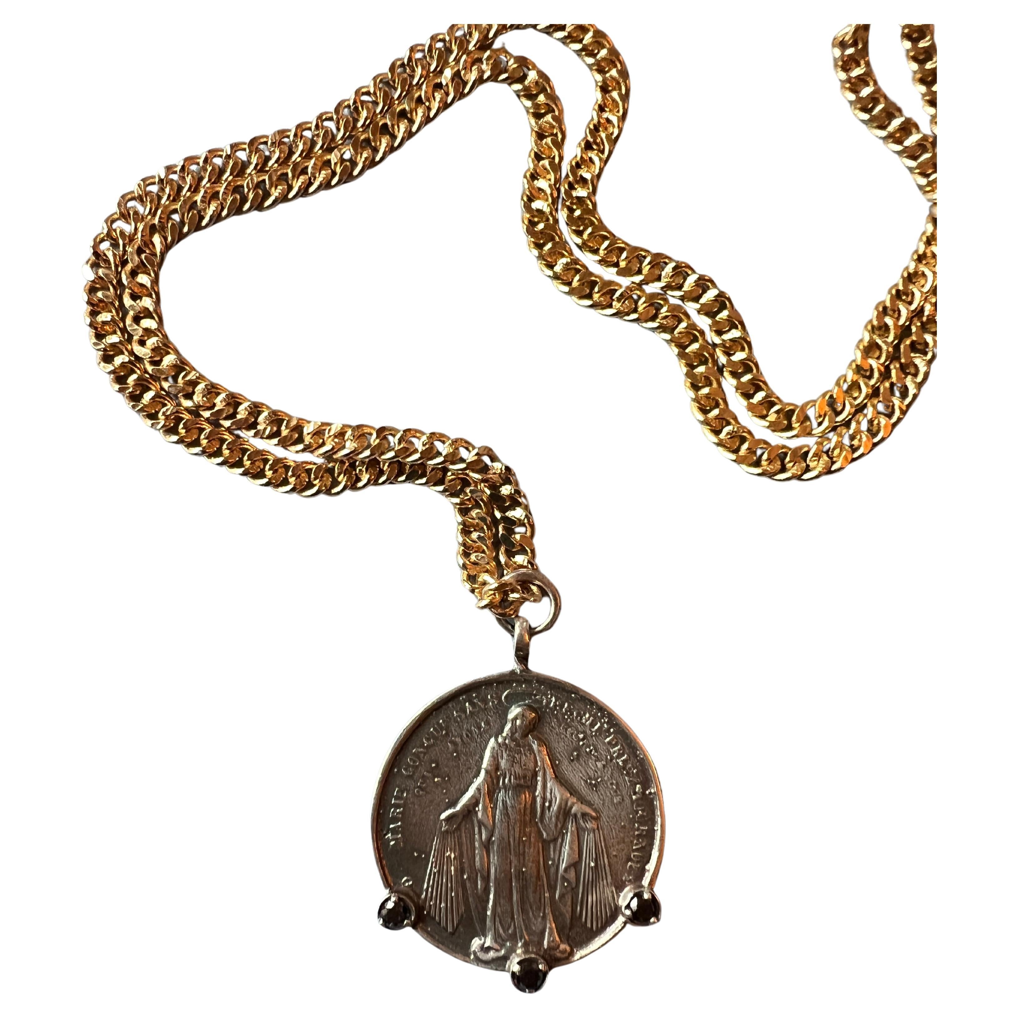 Medal Chain Necklace Virgin Mary 3 pieces Black Diamond, Solid Silver Pendant and Gold plated Brass Chain Necklace

Designer: J DAUPHIN 

Black diamonds, also known as carbonado diamonds, are distinctive for their dark hue and unique origins. Unlike