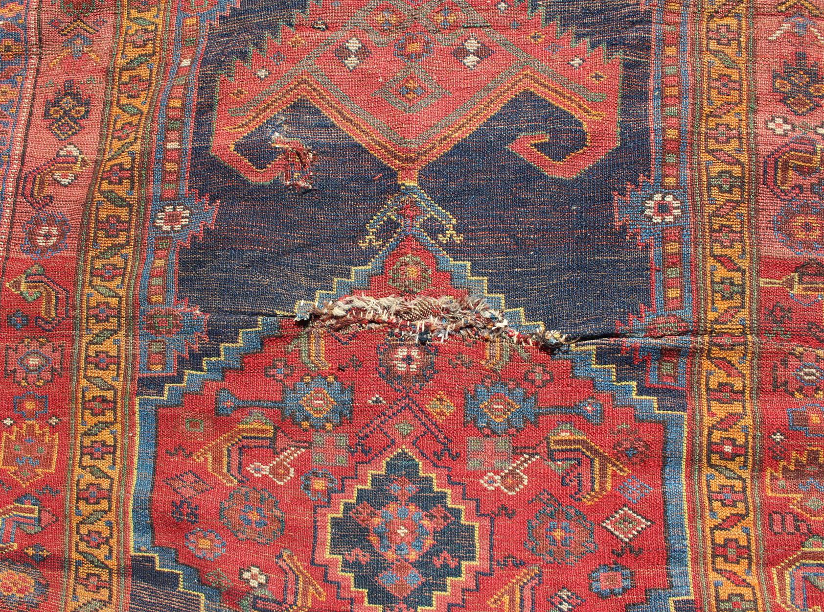 Tribal Medallion Design Antique Persian Kurdish Runner in Red and Blue For Sale