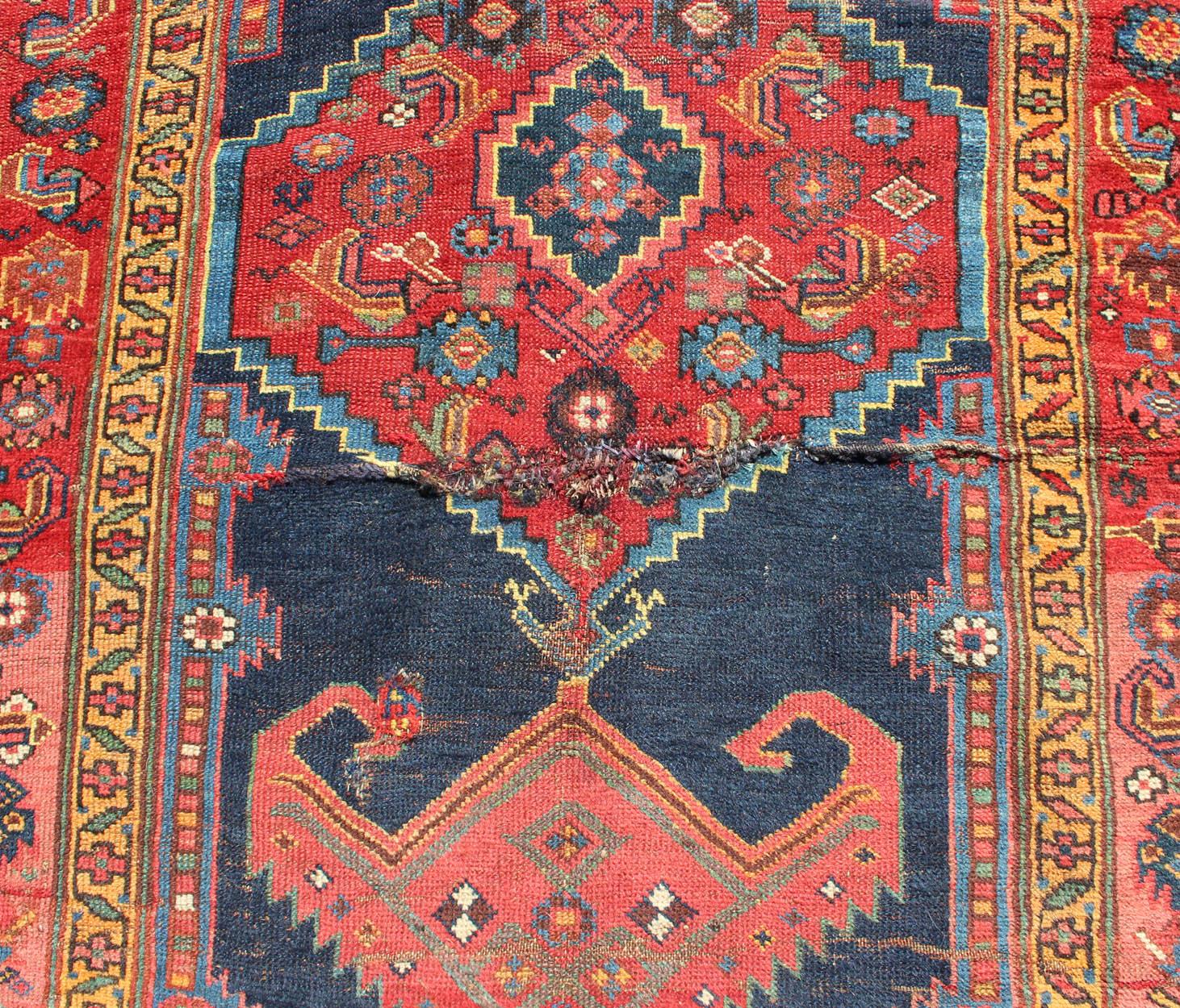 Early 20th Century Medallion Design Antique Persian Kurdish Runner in Red and Blue For Sale