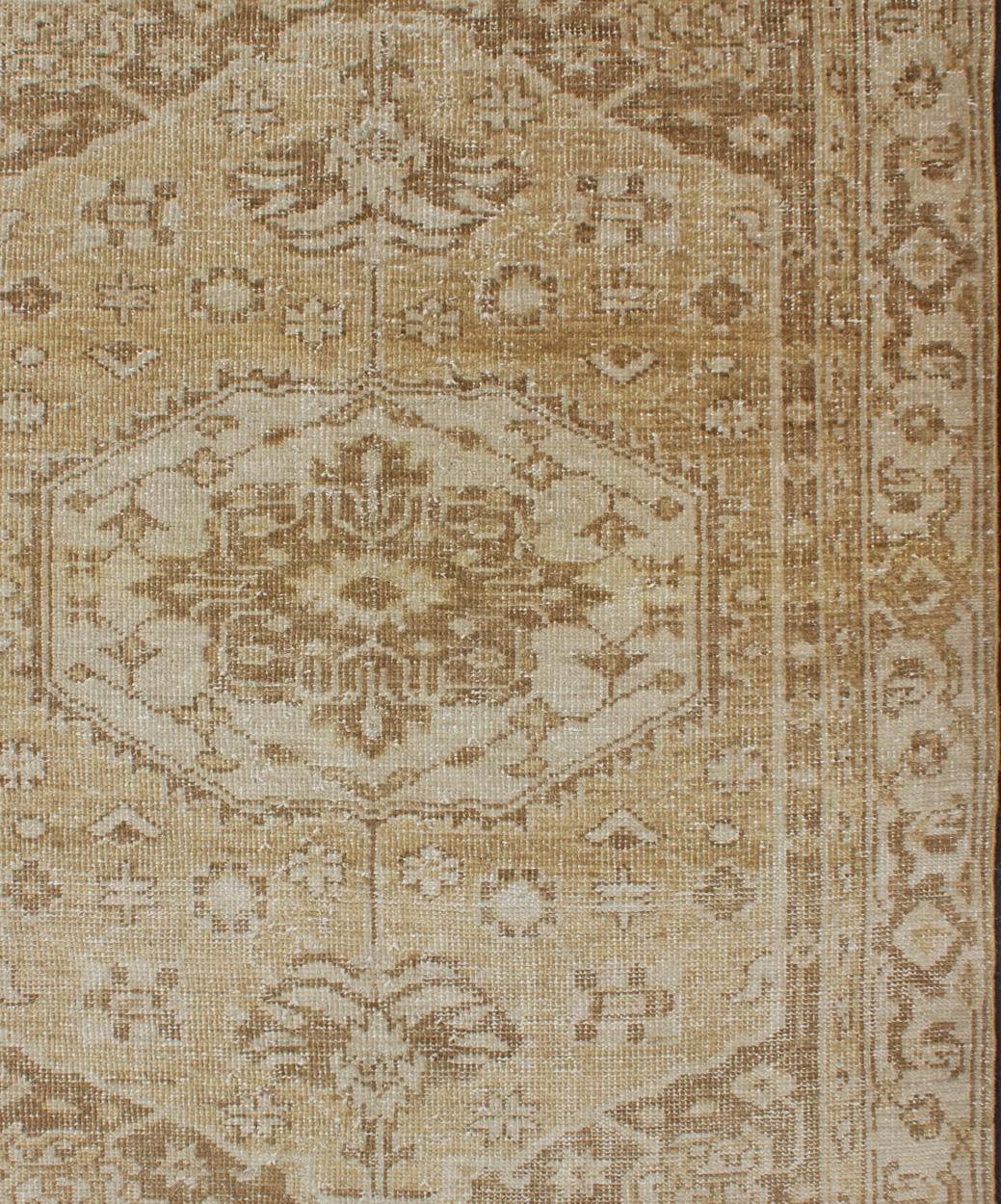 Oushak design rug in brown, taupe, cream, yellow with geometric large medallion design, rug/OB-9299492, country of origin / type: India/ Oushak

This hand knotted Oushak rug features a beautiful medallion design rendered warm and soft tones. 
