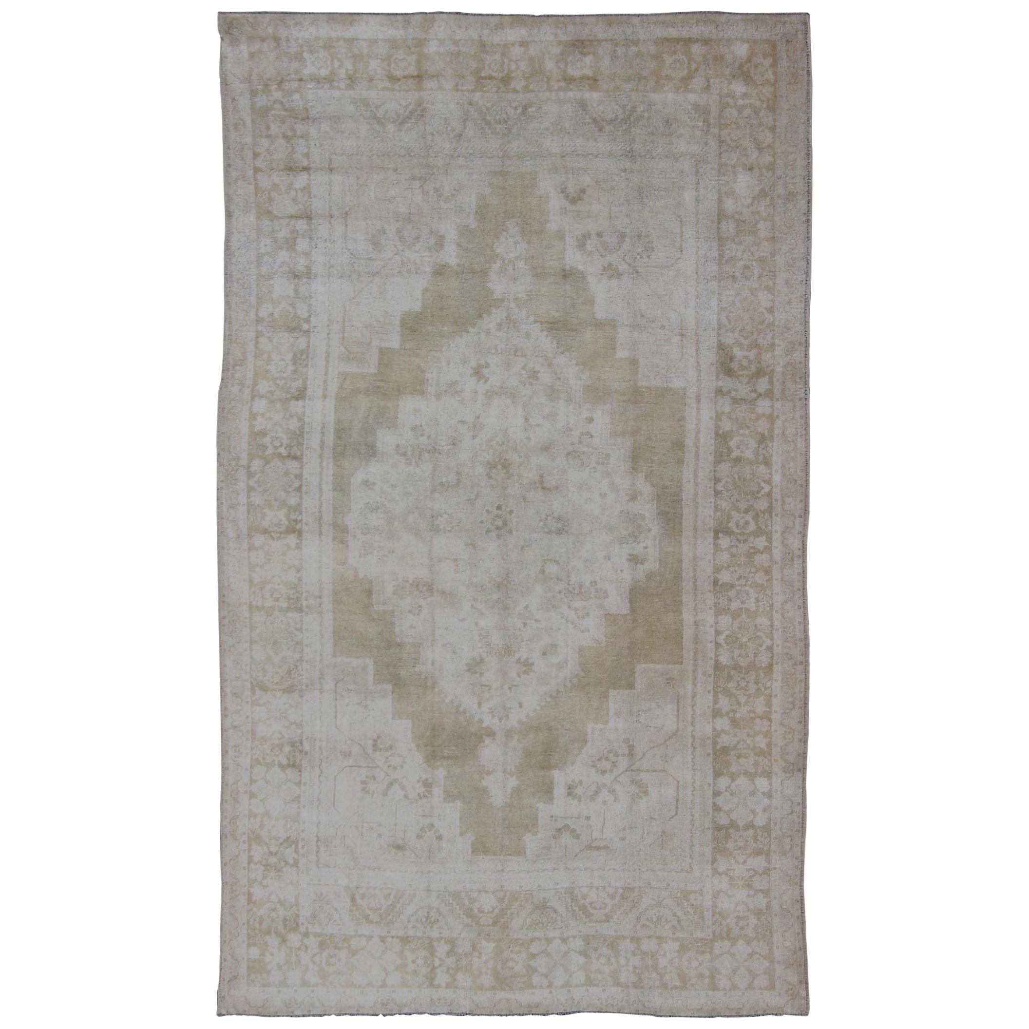Medallion Design Vintage Oushak Rug in Muted Tones of Faded Yellow and Neutrals For Sale