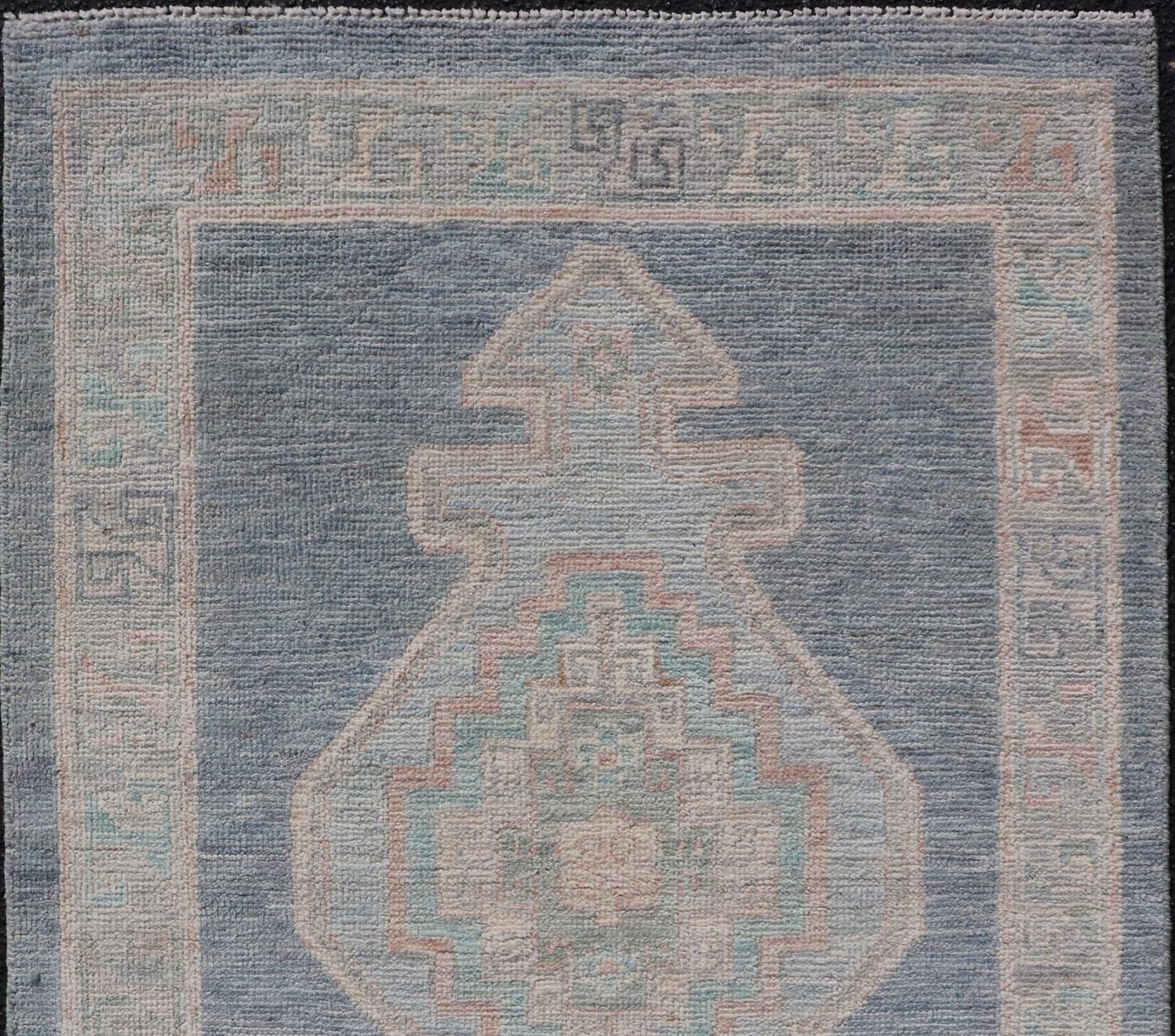 Wool Medallion Designed Modern Oushak with Blue Background and Cream Border For Sale