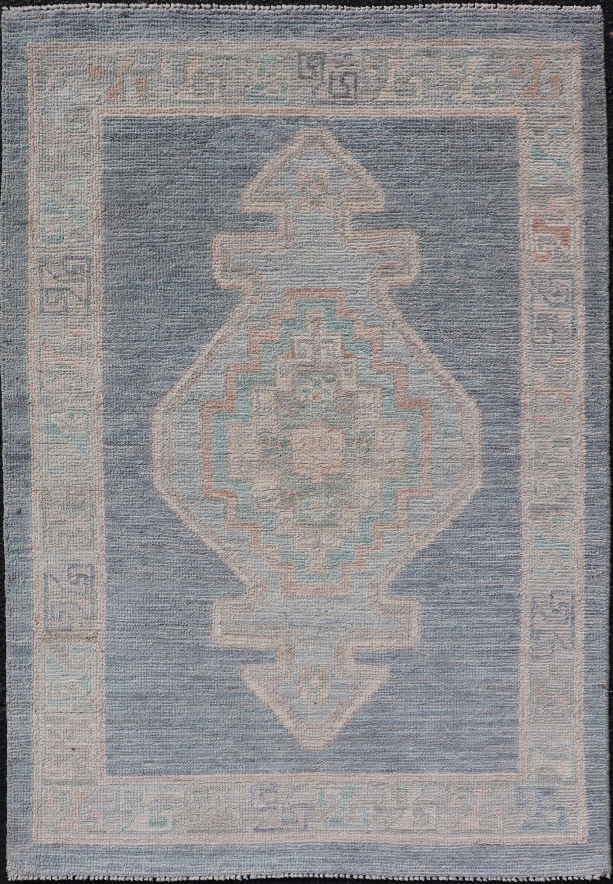 Medallion Designed Modern Oushak with Blue Background and Cream Border For Sale