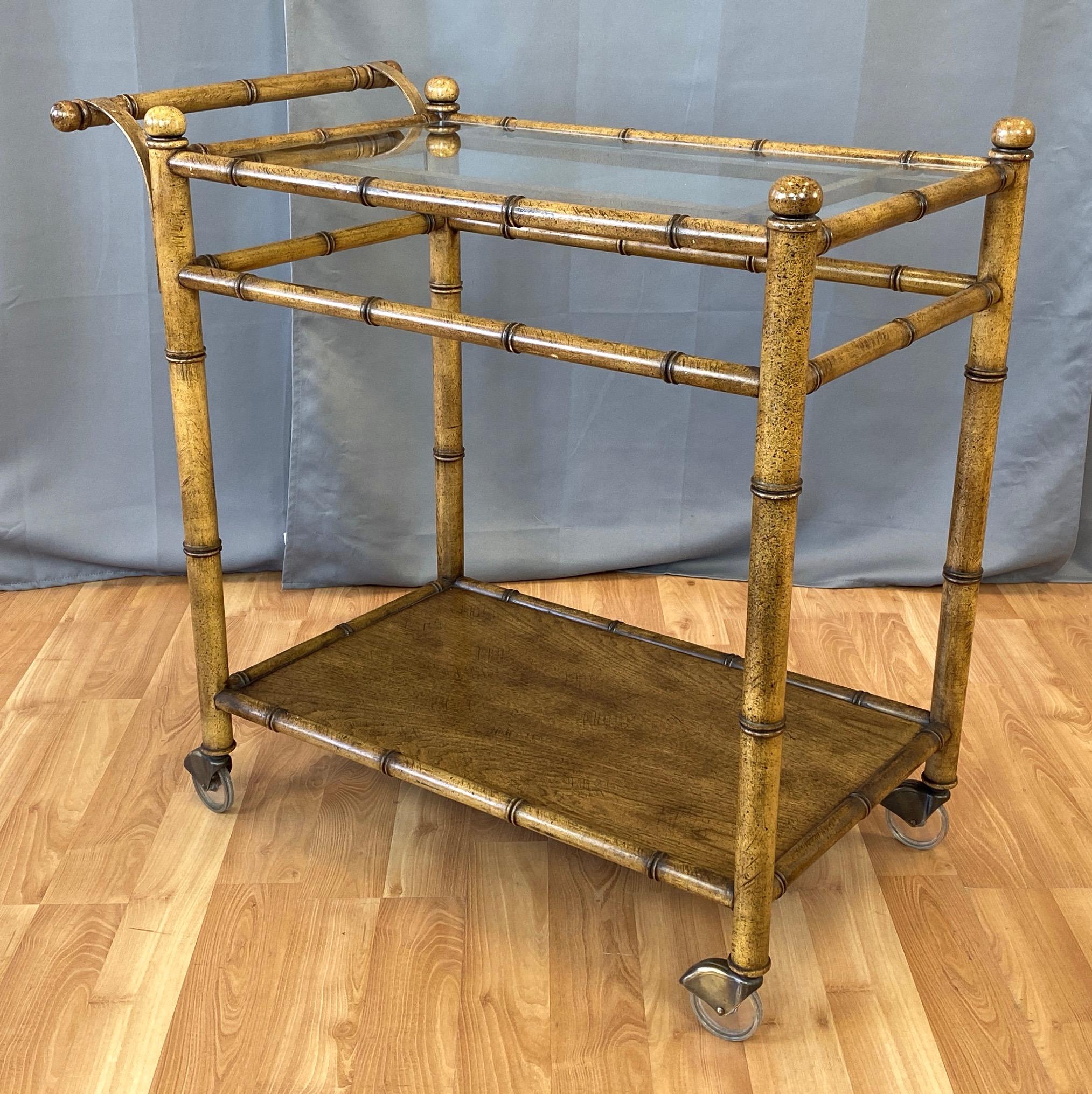 A generously sized and rare 1960s Chinese Chippendale-style faux bamboo and glass bar or serving cart by Medallion Limited.

Stylized bamboo motif oak frame done in the manner of Hollywood Regency period Chippendale or Kittinger chinoiserie chairs