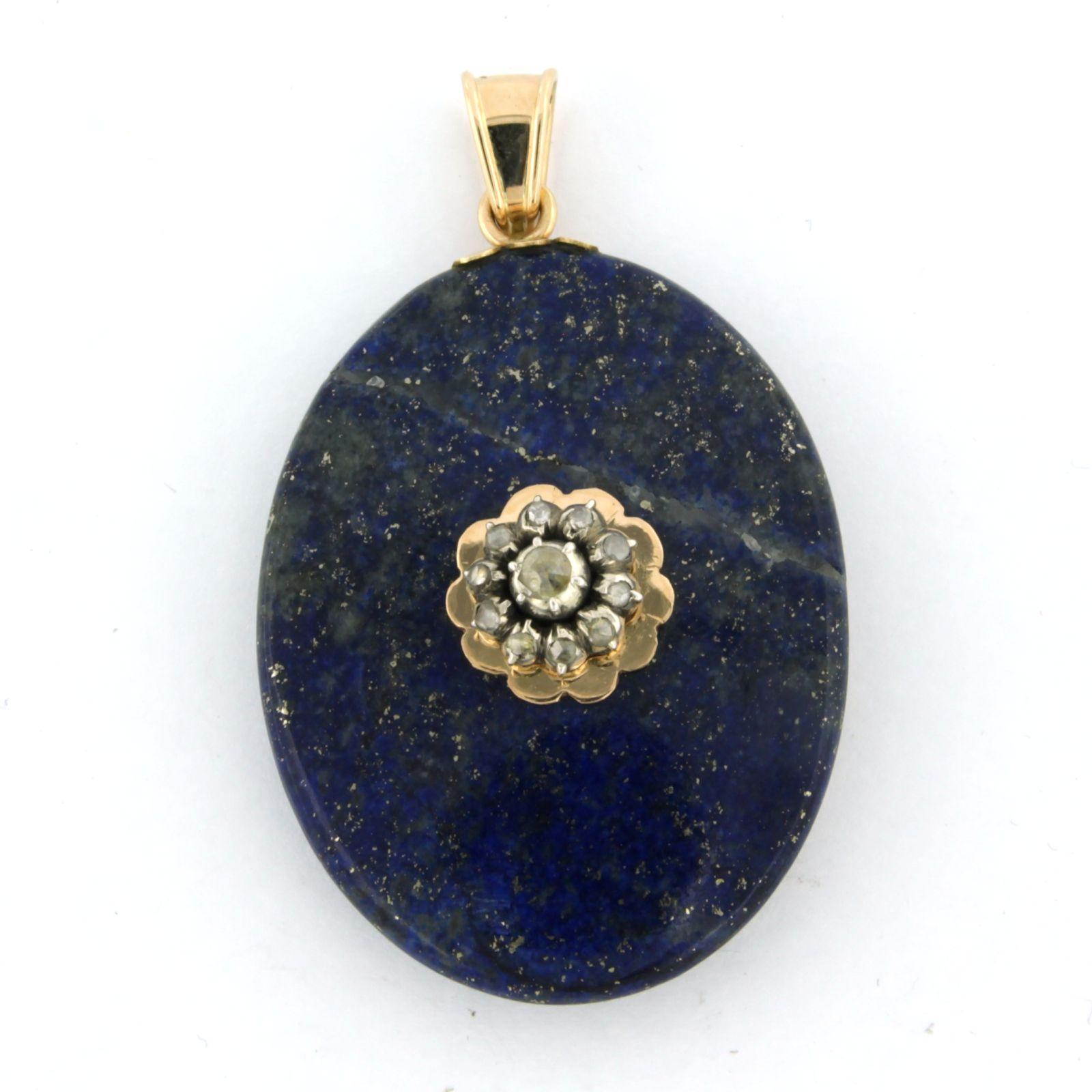 14k gold medallion pendant with lapis lazuli and rose diamonds set on silver. 0.15ct – G/H – SI

Detailed description

the size of the pendant is 5.5 cm long by 3.3 cm wide

weight 18.6 grams

set with

- 1 x 4.4 cm x 3.3 cm oval cut lais