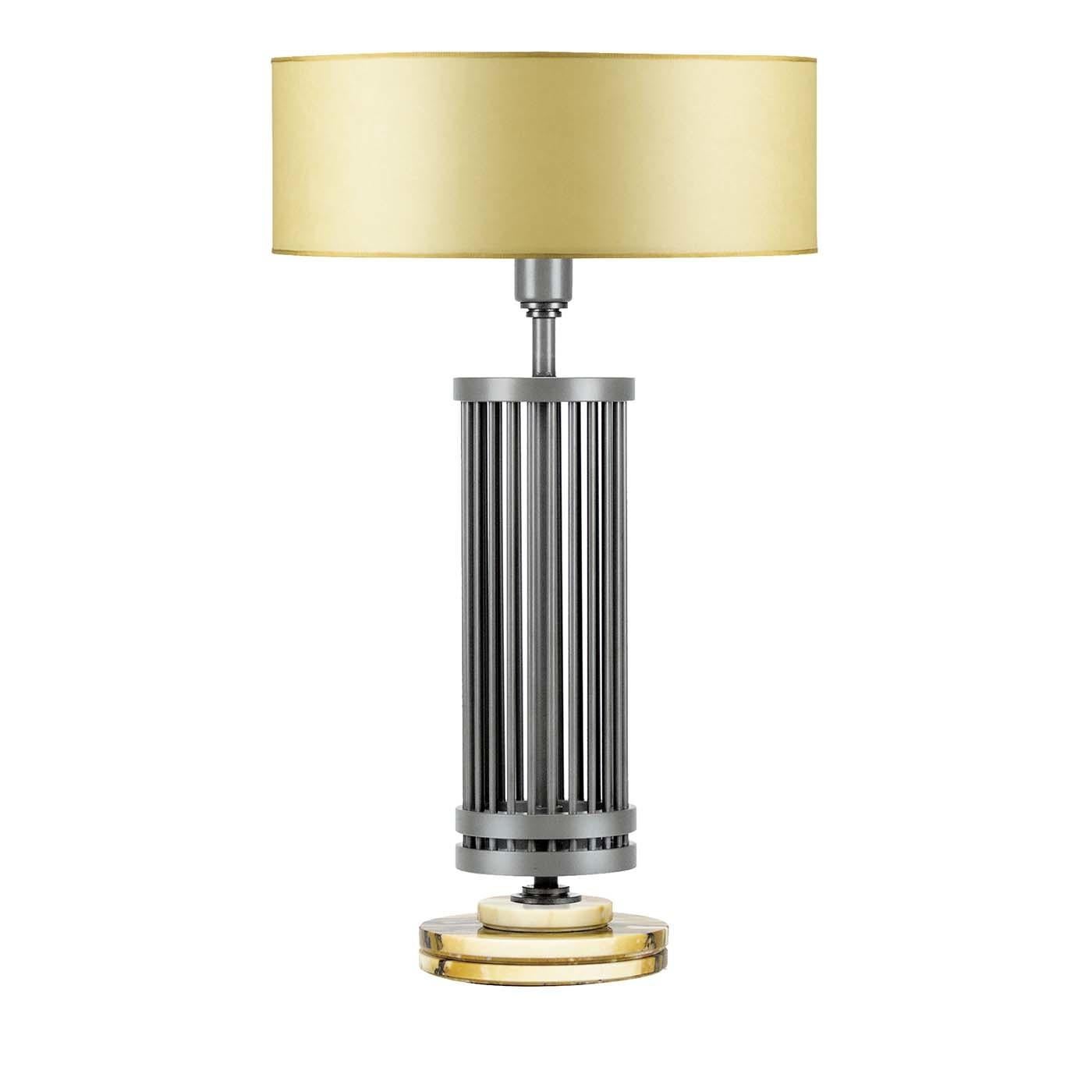 From the master suite to the living room, this stunning table lamp is a sure way to brighten up any interior while adding style and elegance to any decor. Raised on a stunning circular base of Giallo Siena marble whose light and dark yellow veins