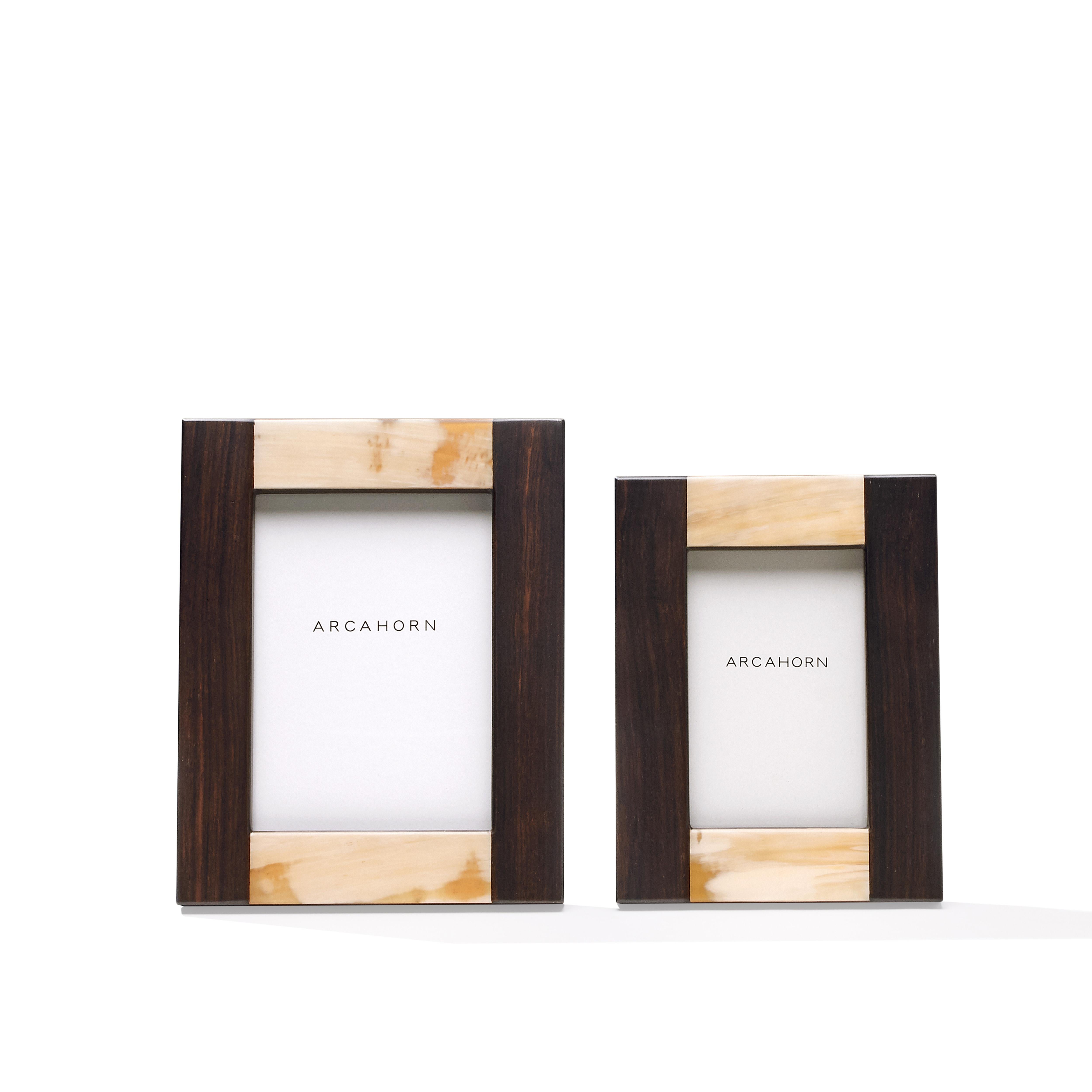 Featuring a classic rectangular shape, the Medea picture frame in Amara ebony veneer is given an elegant, textured effect by the striated nuances of matte Corno Italiano inlays. Available in two different sizes, Medea will display your unforgettable