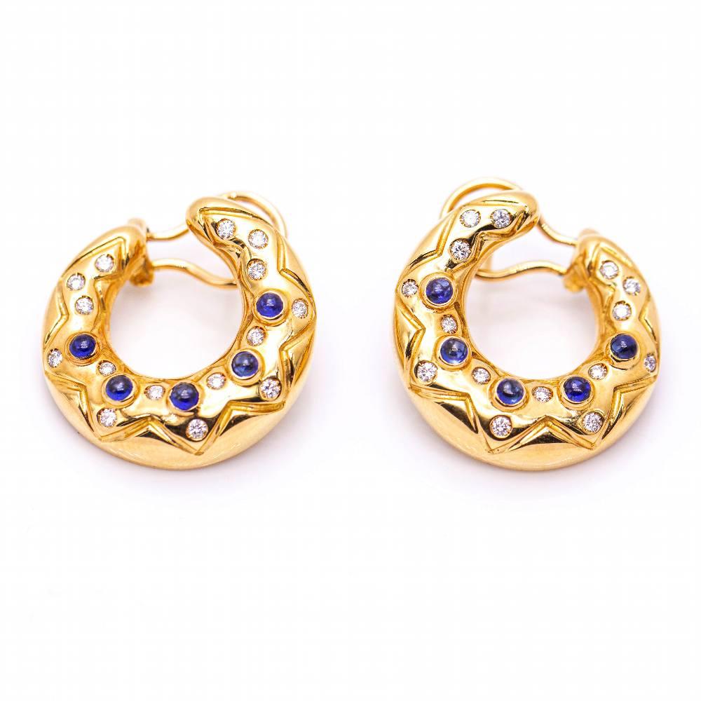 Earrings in Yellow Gold with Sapphires and Diamonds  Brilliant Cut Diamonds with a total weight of 0.45cts. in G/VS quality  Sapphire with a total weight of 1.05ct  18kt Yellow Gold  Omega Clasp  17.00 grams.  Width 2,2cm  Brand new product. Ref: