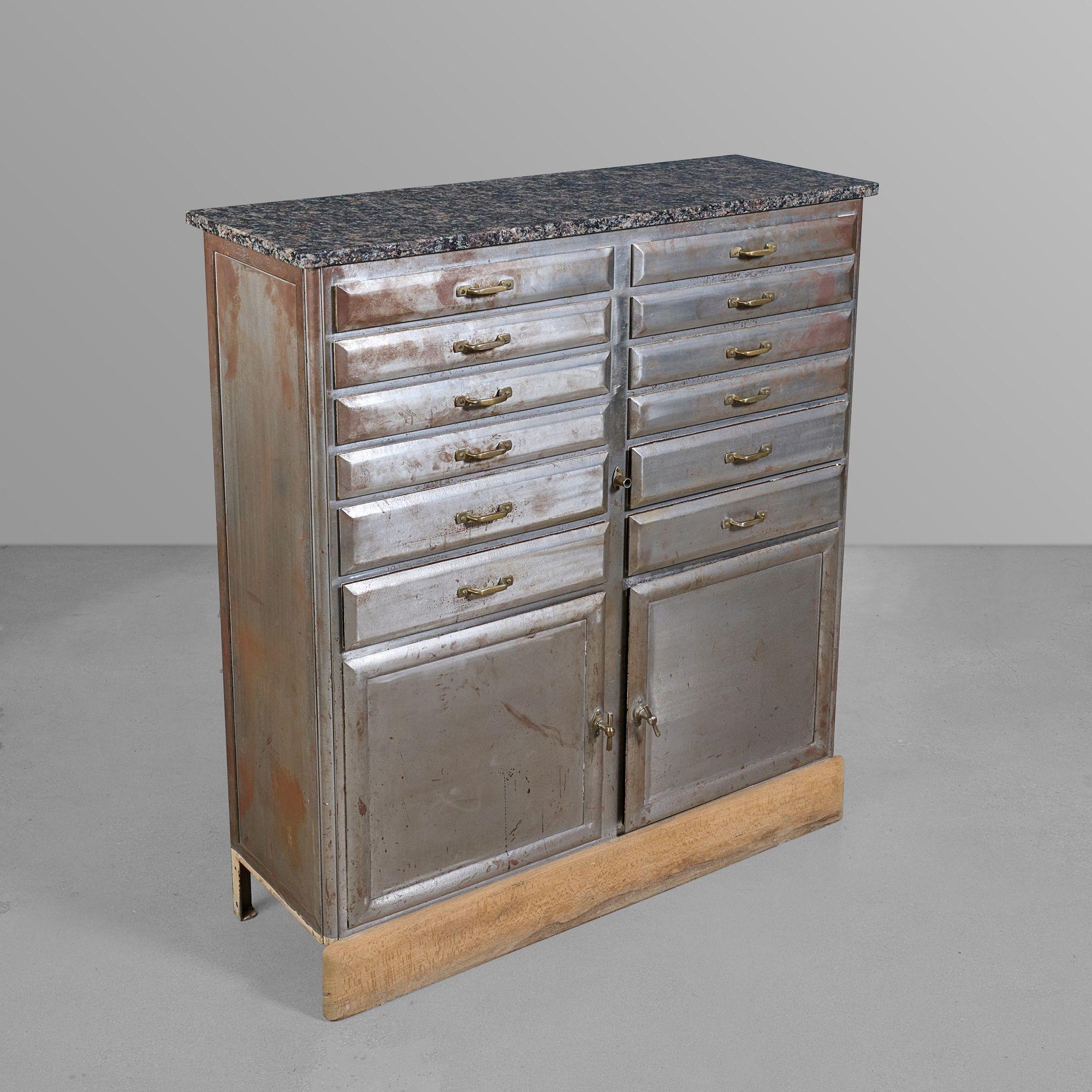 Polished iron, marble, wood, brass medical cabinet.