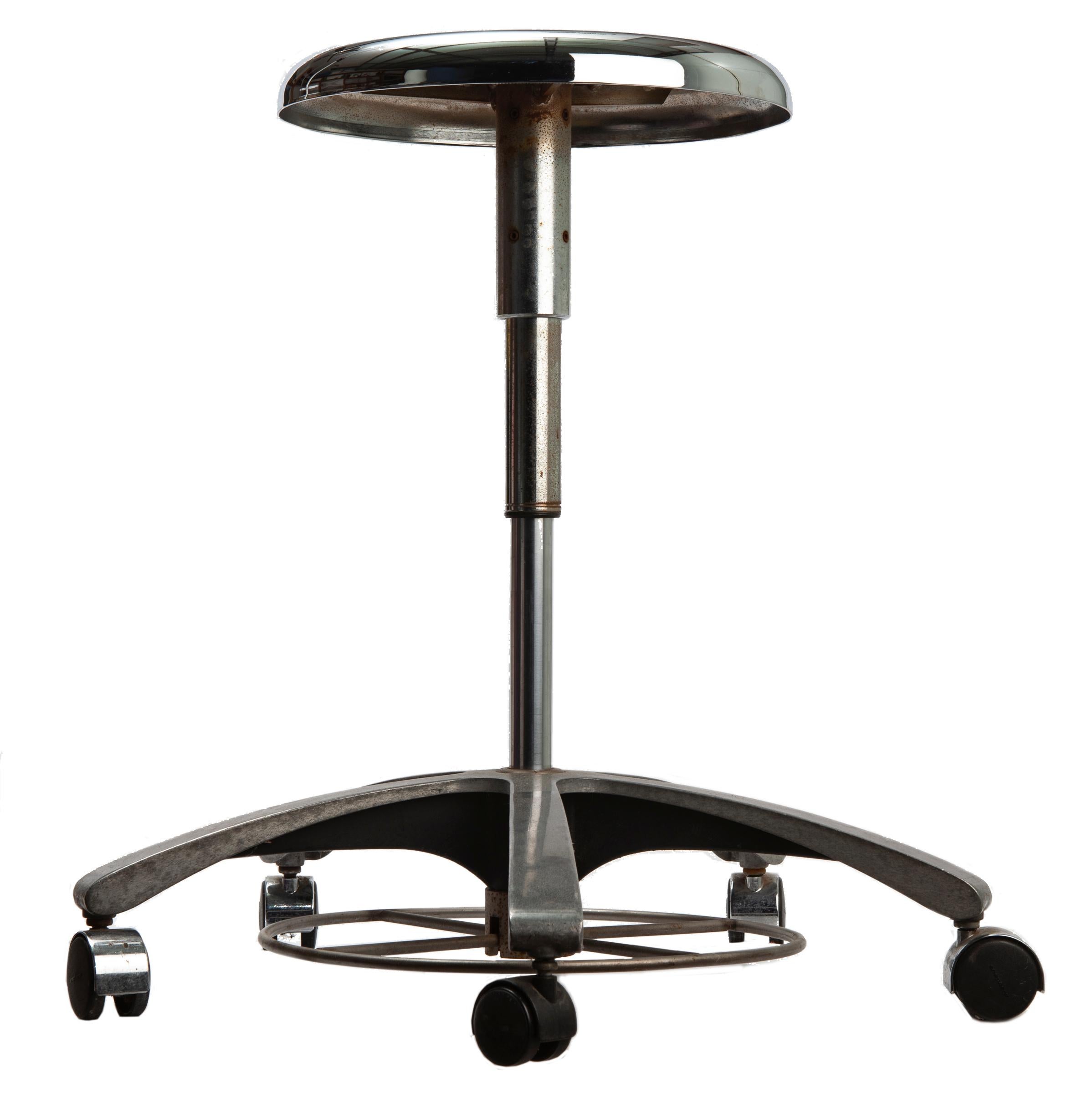 Mid century chrome medical/dental stool, effortlessly swivels around .
The wheels are made of a resin material, the stretcher are made of chrome. 
A great piece for small spaces, easily tucks away. Original wheels/castors.