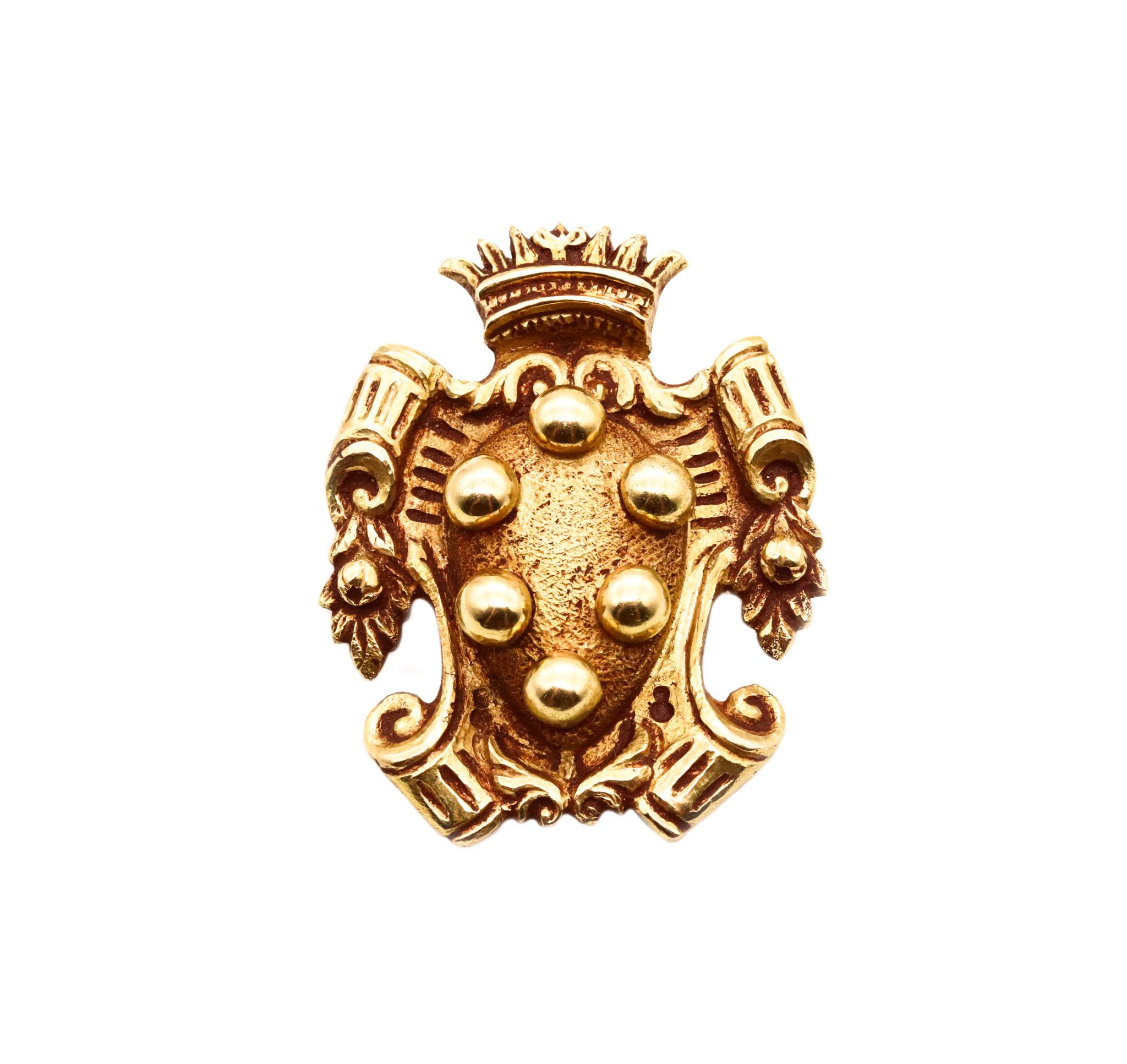 Brooch with the Medici Coat of Arms.

An antique Italian piece made in Florence, circa 1850 in the renaissance shape of the coat of arms of the Medici family. It was crafted in three-dimensions in solid 18 karats of textured yellow gold and suited