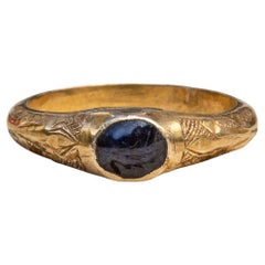 Antique Medieval 14th-15th Century Gold and Sapphire Engraved Amuletic Stirrup Ring