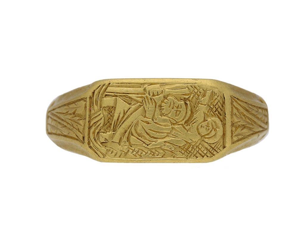 Mittelalterlicher ikonografischer Ring mit dem Heiligen Christophe. Gelbgoldring mit rechteckiger Lünette, fein graviert mit einer Darstellung des heiligen Christophorus, der das Christuskind auf dem Rücken trägt und durch einen Fluss watet. Die
