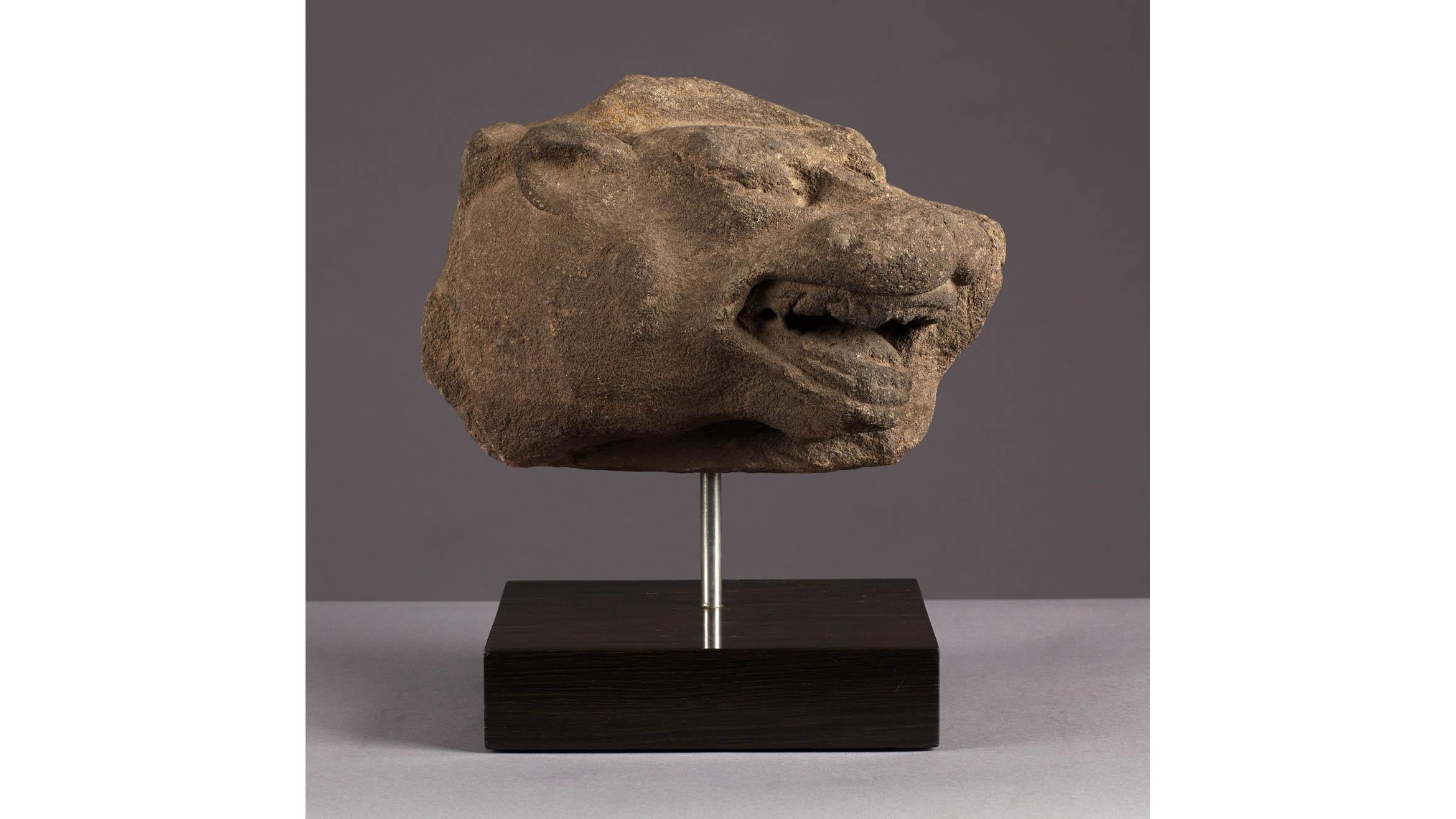 Mid-15th century gritstone head of a leopard, Staffordshire, circa 1450-1460.

The profile carving of a Leopard head with gaping toothed mouth. The sculpture is made from red or white Staffordshire gritstone.

Measure: Mounted height 16