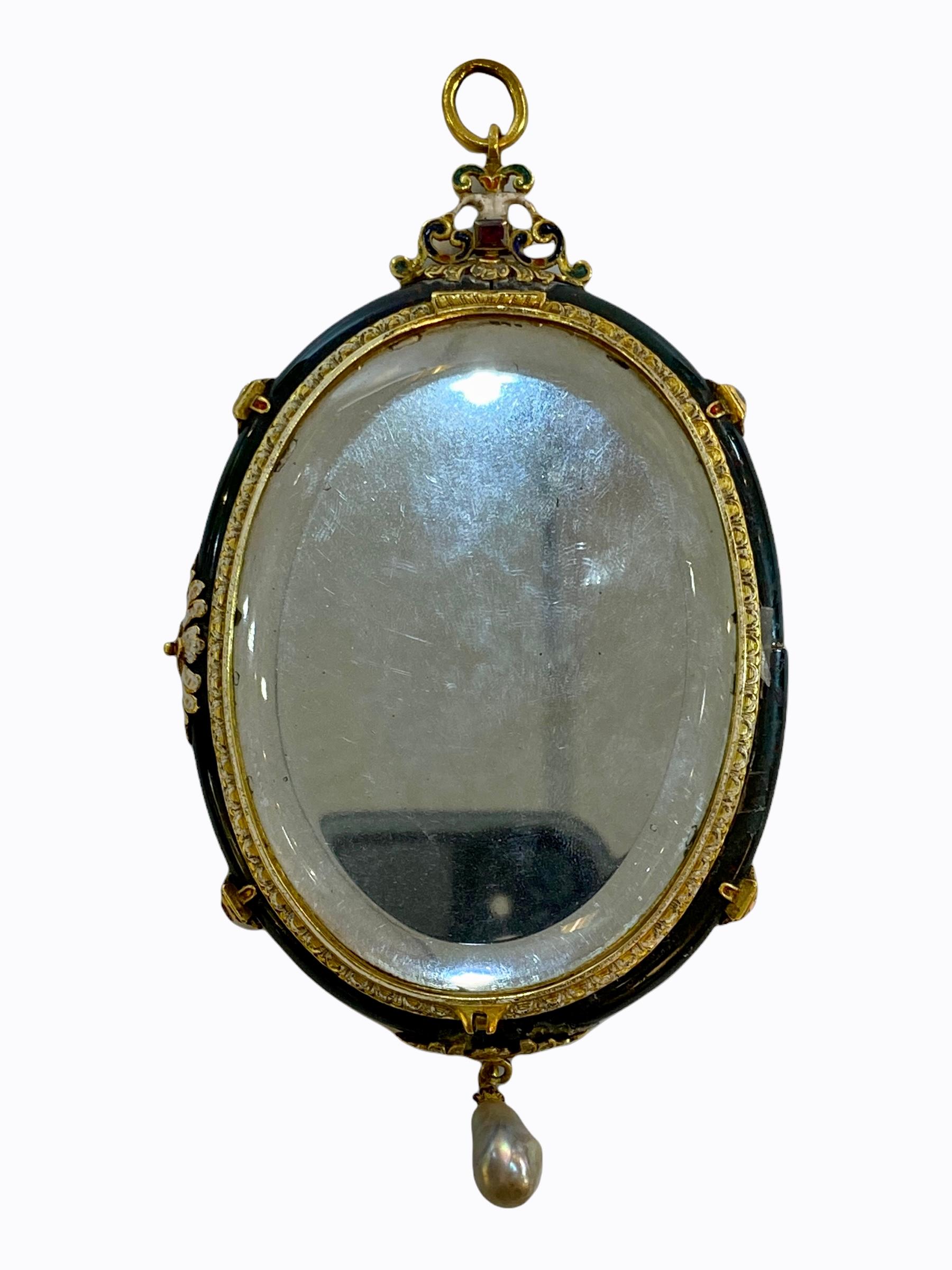 Our antique neoclassical hand mirror, designed as a pendant to hang from a necklace, with exceptional enameled back and gilded designs in the medieval style includes a banner that reads VT VIDI VT PERII in Latin which translates to As I Saw, I
