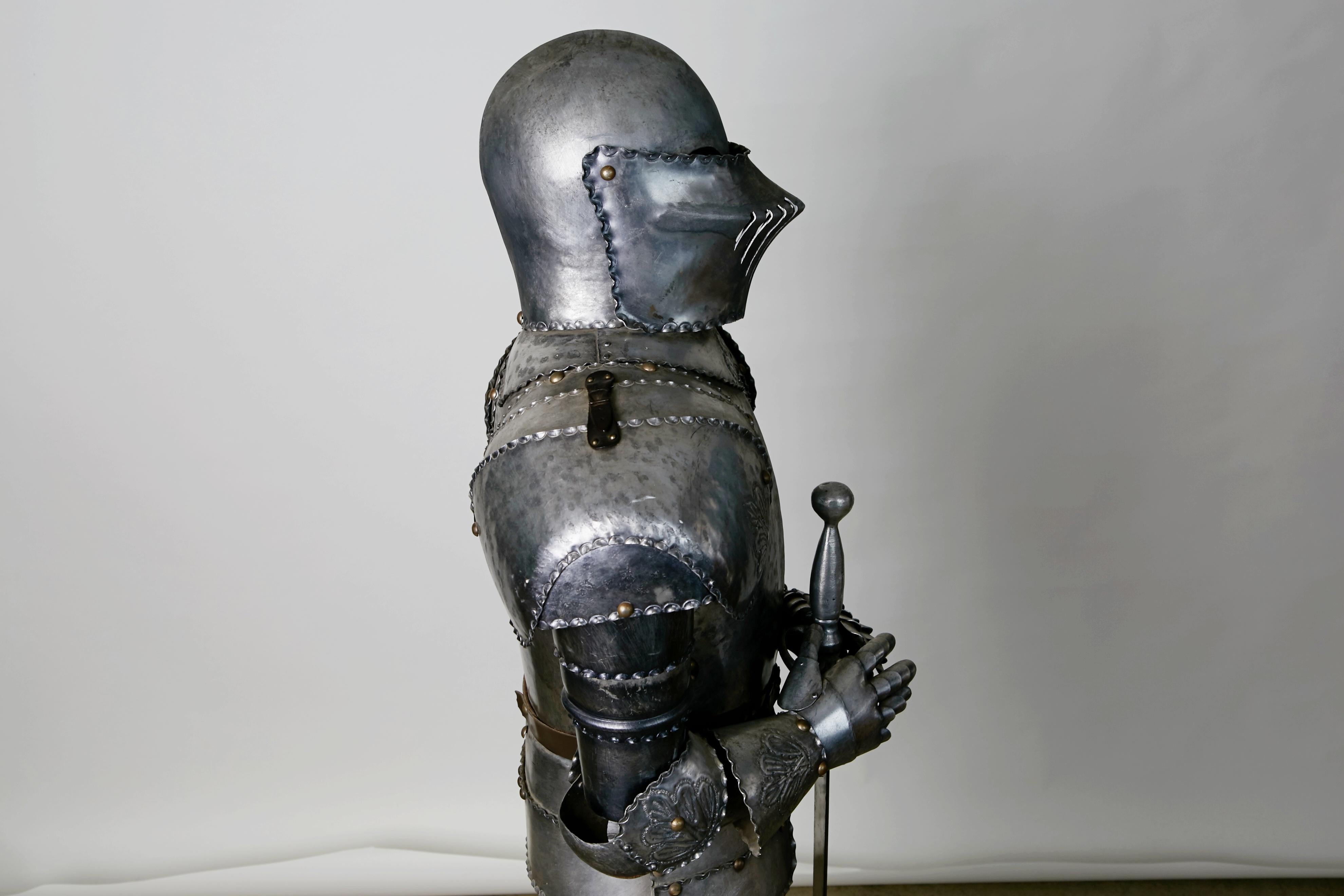 Metal Medieval Style Suit of Fully Articulating Armor with Sword on Display Stand