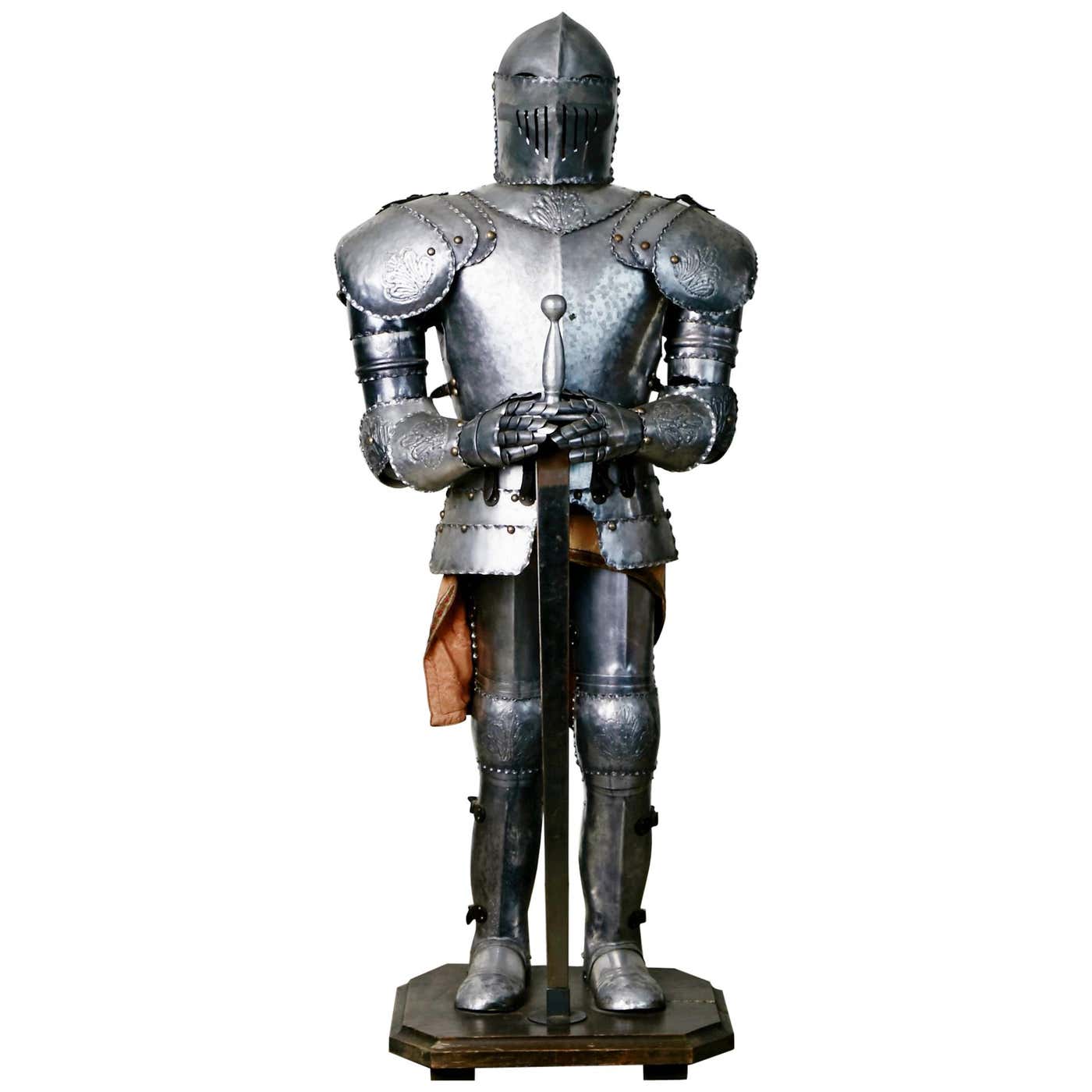Medieval Style Suit Of Fully Articulating Armor With Sword On Display medieval-style-suit-of-fully-articulating-armor-with-sword-on-display