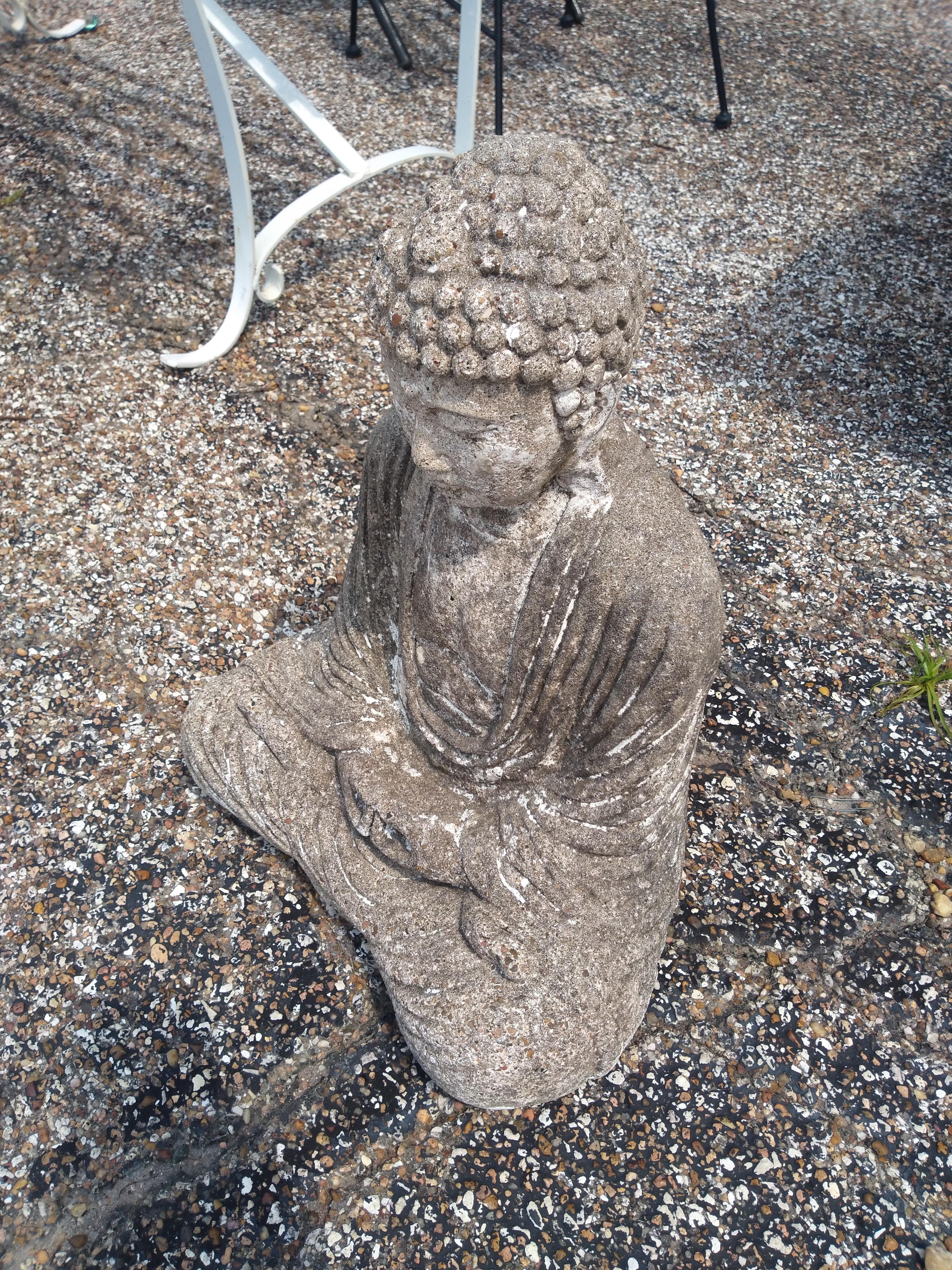 This meditating sculpture of Buddha is cast in concrete. A great addition to your garden or patio area.