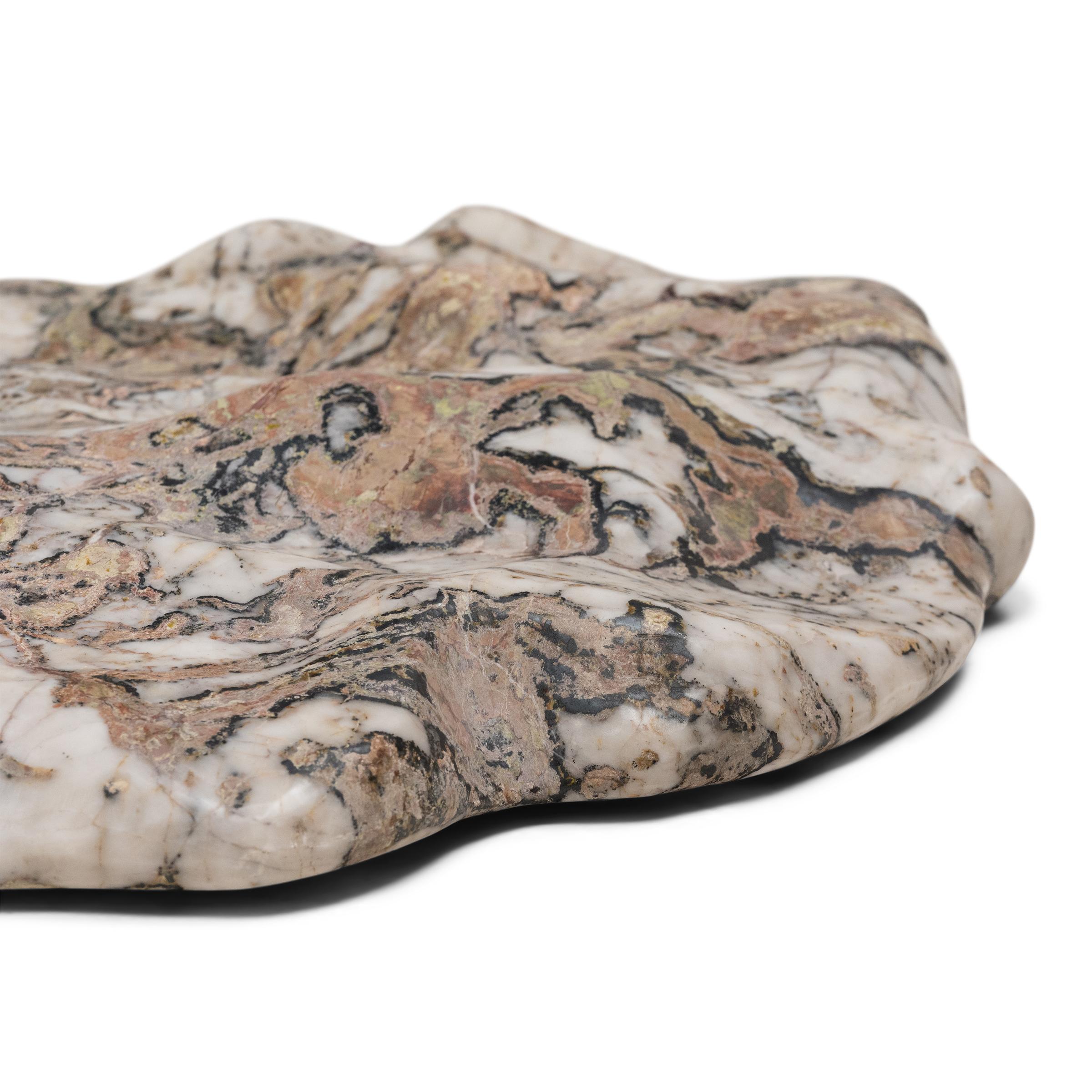 Sourced from China’s Jiangsu province, this meditation stone slab was carefully selected for its biomorphic shape and irregular patterning, its white marble field marked by currents of pale green, black and iron red. The slab has been polished to
