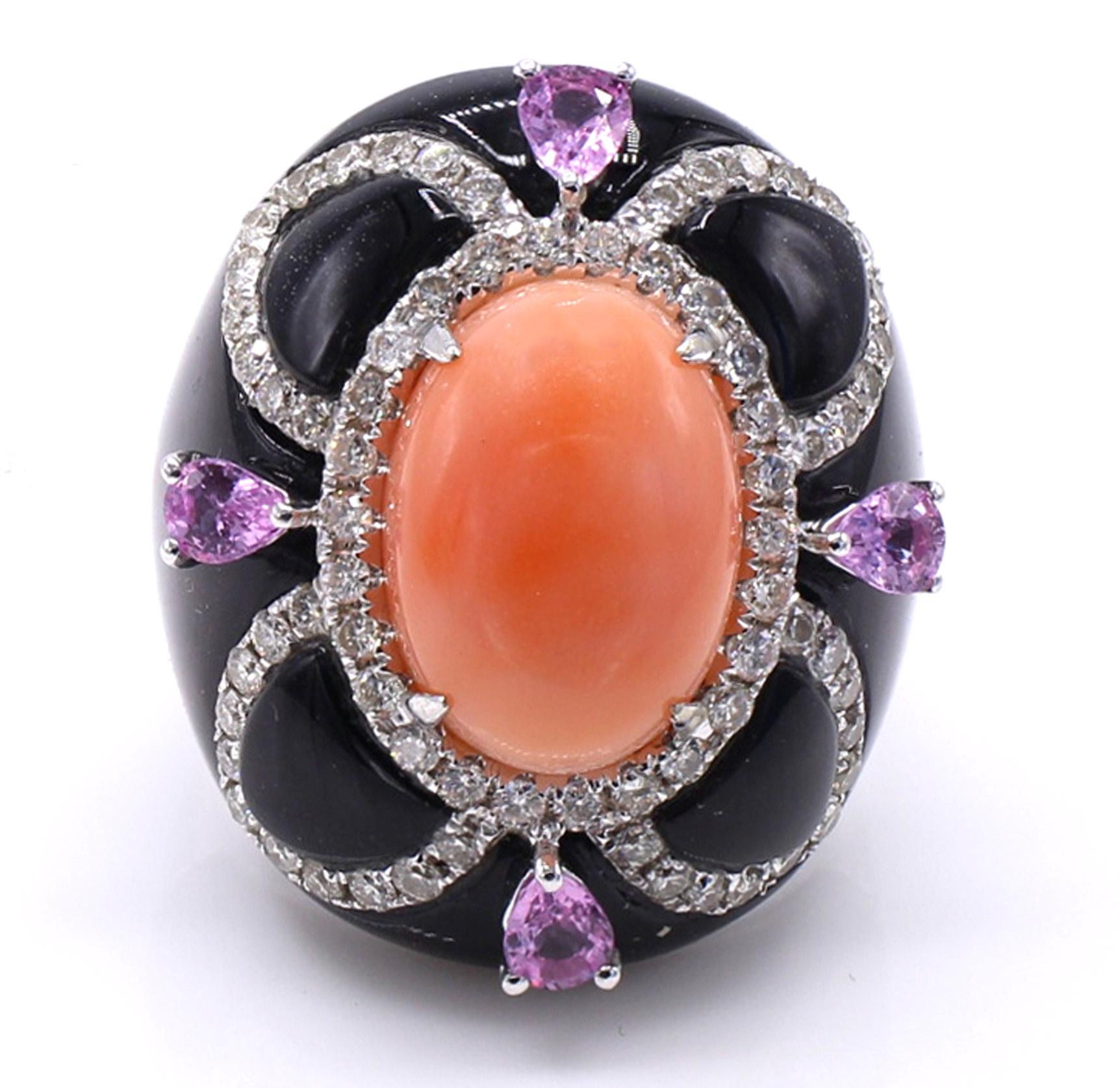 Beautifully designed and masterfully handcrafted this fashionable, chic and colorful ring is a piece of art on the finger. Centrally set with a light pink oval coral cabochon, embellished by a ring of bright white and sparkly round brilliant cut