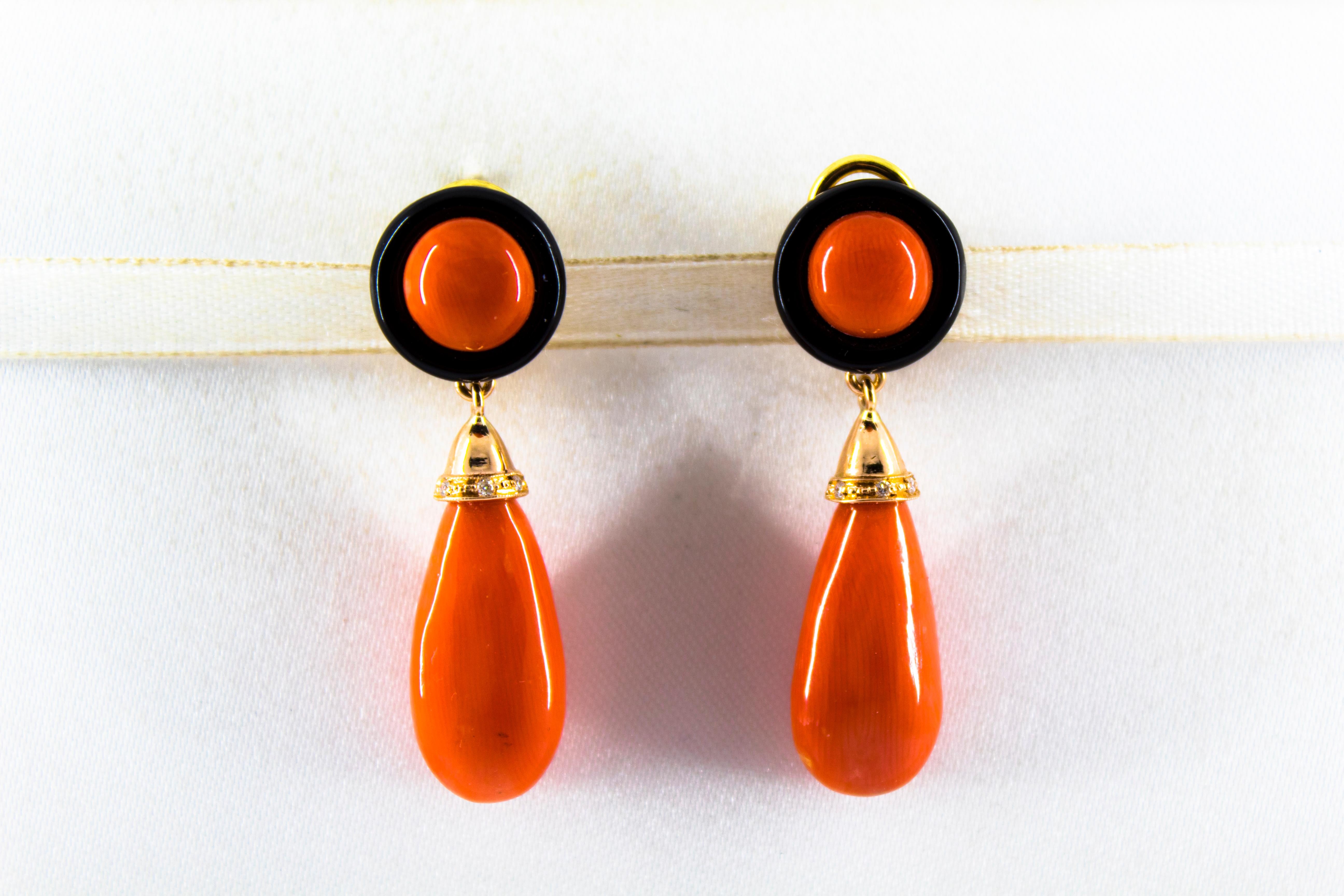 These Clip-On Earrings are made of 14K Yellow Gold with 18K Yellow Gold Clips.
These Earrings have 0.05 Carats of White Diamonds.
These Earrings have Red Mediterranean (Sardinia, Italy) Coral.
These Earrings have also Onyx.
We're a workshop so every