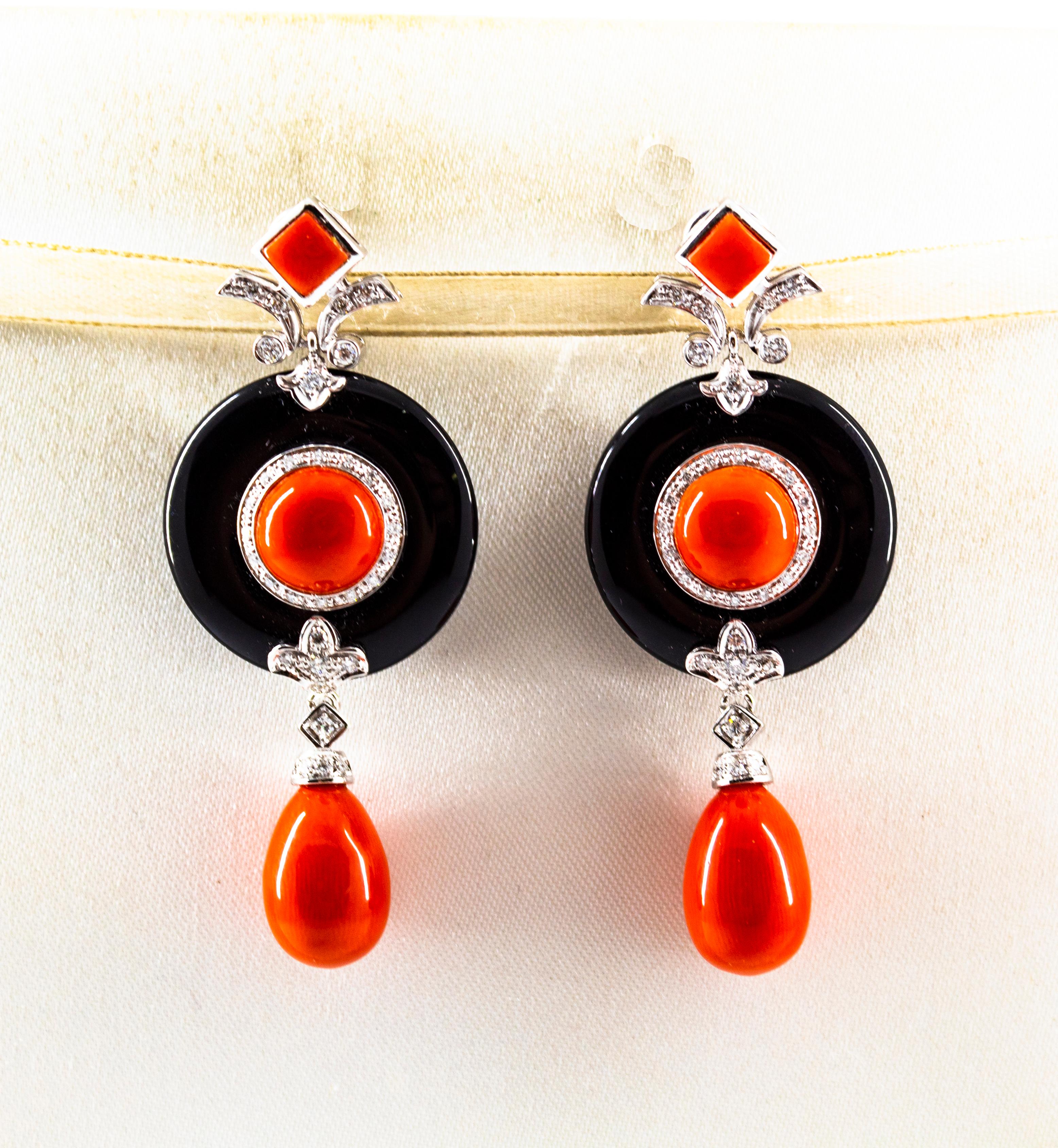 These Clip-On Earrings are made of 14K White Gold with 18K White Gold Clips.
These Earrings have 0.70 Carats of White Diamonds.
These Earrings have Red Mediterranean (Sardinia, Italy) Coral.
These Earrings have also Onyx.
All our Earrings have pins