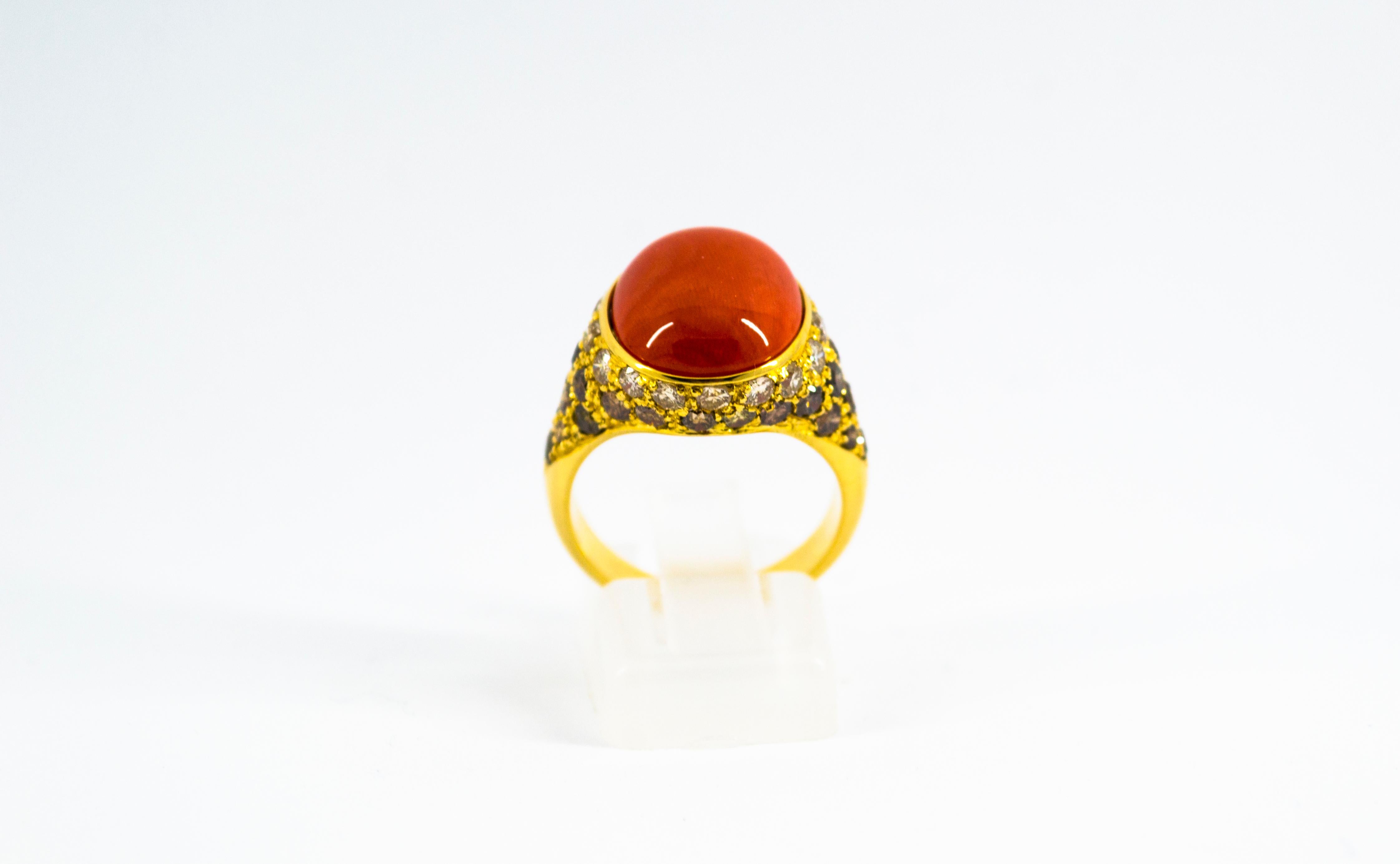 This Ring is made of 18K Yellow Gold.
This Ring has 0.80 Carats of White Diamonds.
This Ring has 1.40 Carats of Brown Diamonds.
This Ring has a Mediterranean Cabochon (Sardinia, Italy) Red Coral.
Size ITA: 13 USA: 6 1/2
We're a workshop so every