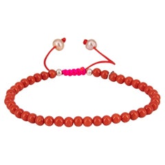 Mediterranean red coral bracelet with neon pink drawstring closure