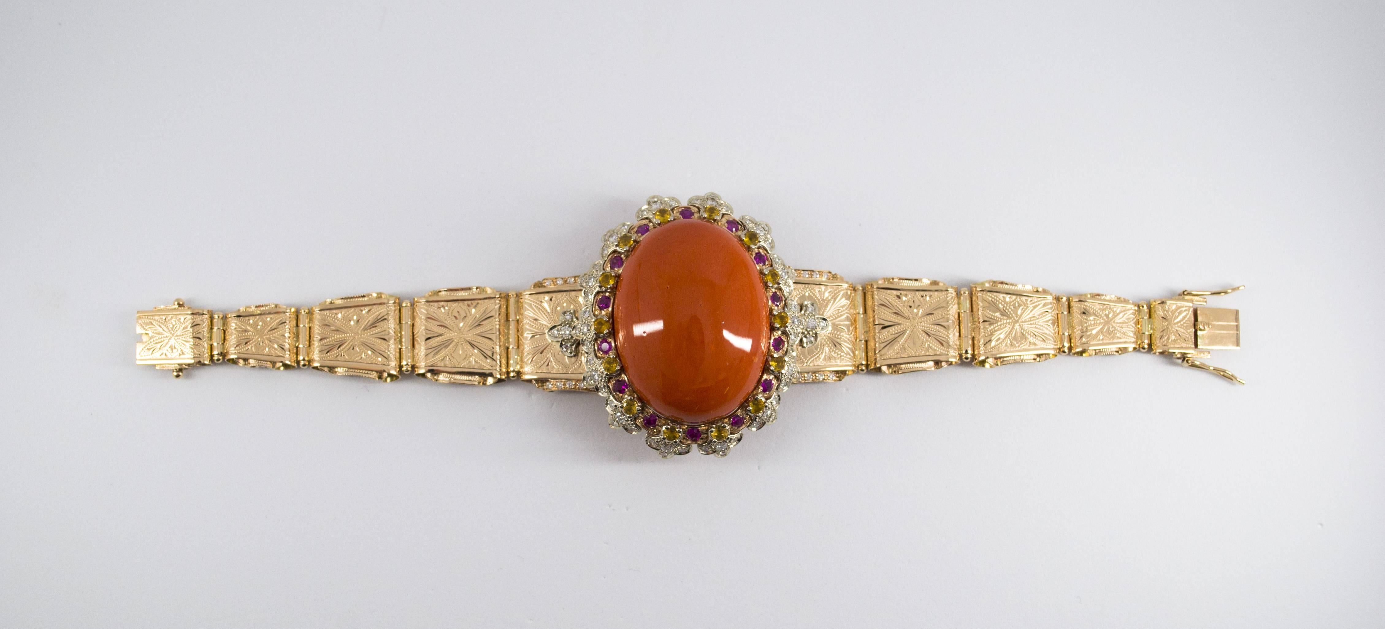 This Bracelet is made of 14K Yellow Gold.
This Bracelet has 1.70 Carats of Diamonds.
This Bracelet has 2.40 Carats of Rubies and Yellow Sapphires.
This Bracelet has also a big Red Mediterranean (Sardinia, Italy) Coral.
We're a workshop so every