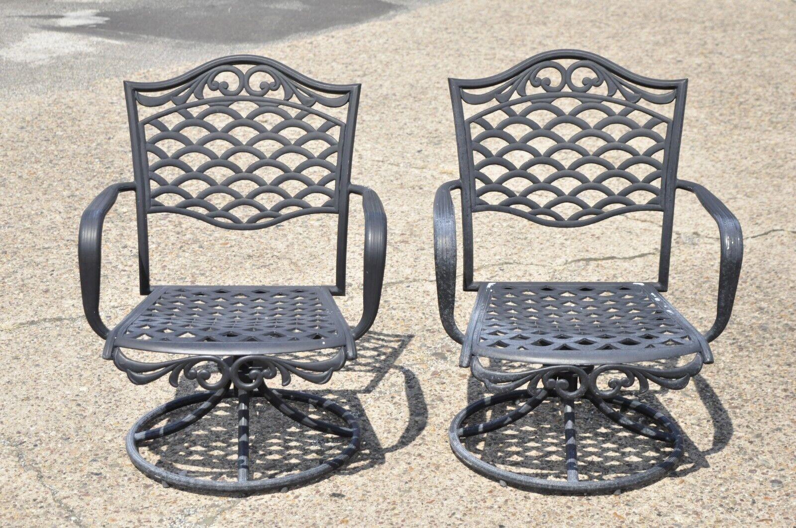 Mediterranean Style Aluminum Swivel and Tilt Black Tuscan Garden Patio Chairs - a Pair Circa  Late 20th century. Measurements: 37