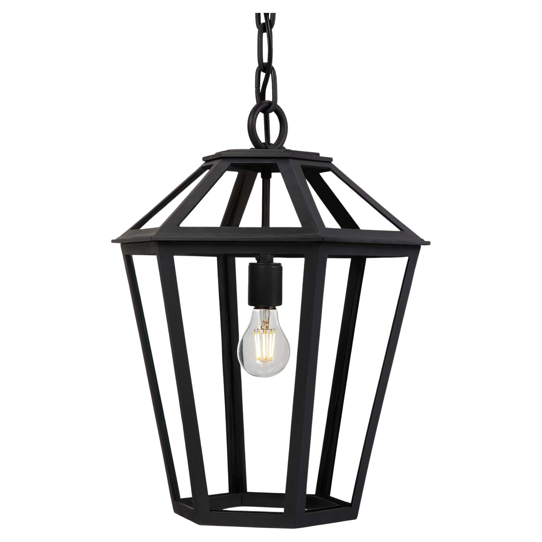 This Heirloom Quality, Hand-Crafted Lantern designed by Architect Anthony Grumbine features a classic tapered form with six glass panels on the top and the bottom, creating dynamic silhouettes from every angle. This large hexagonal fixture is