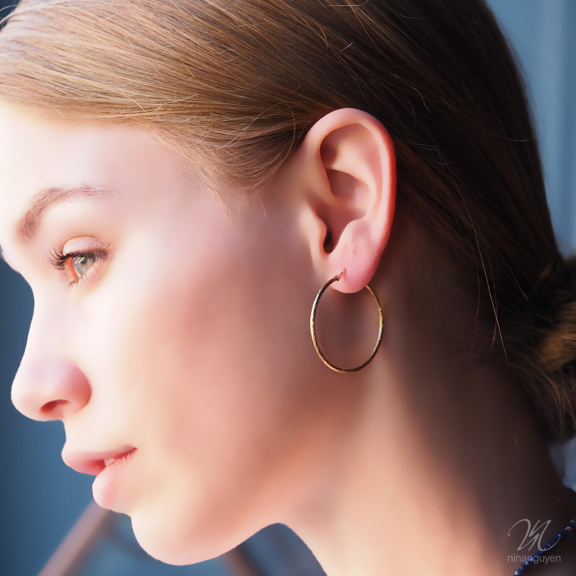 These textured Medium 30mm Gold Hoops are made for dangling a custom-curated batch of your favorite jackets but go ahead and wear them on their own if you want to. They’ll get attention either way. 

Size: 30mm