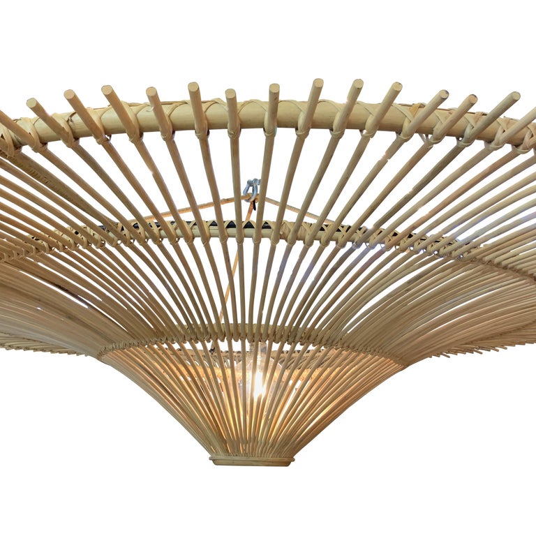 Contemporary Indonesian medium size round umbrella shaped chandelier made of bamboo.
Single bulb.
60watt to 300 watt maximum
Measure: Also available in large 71