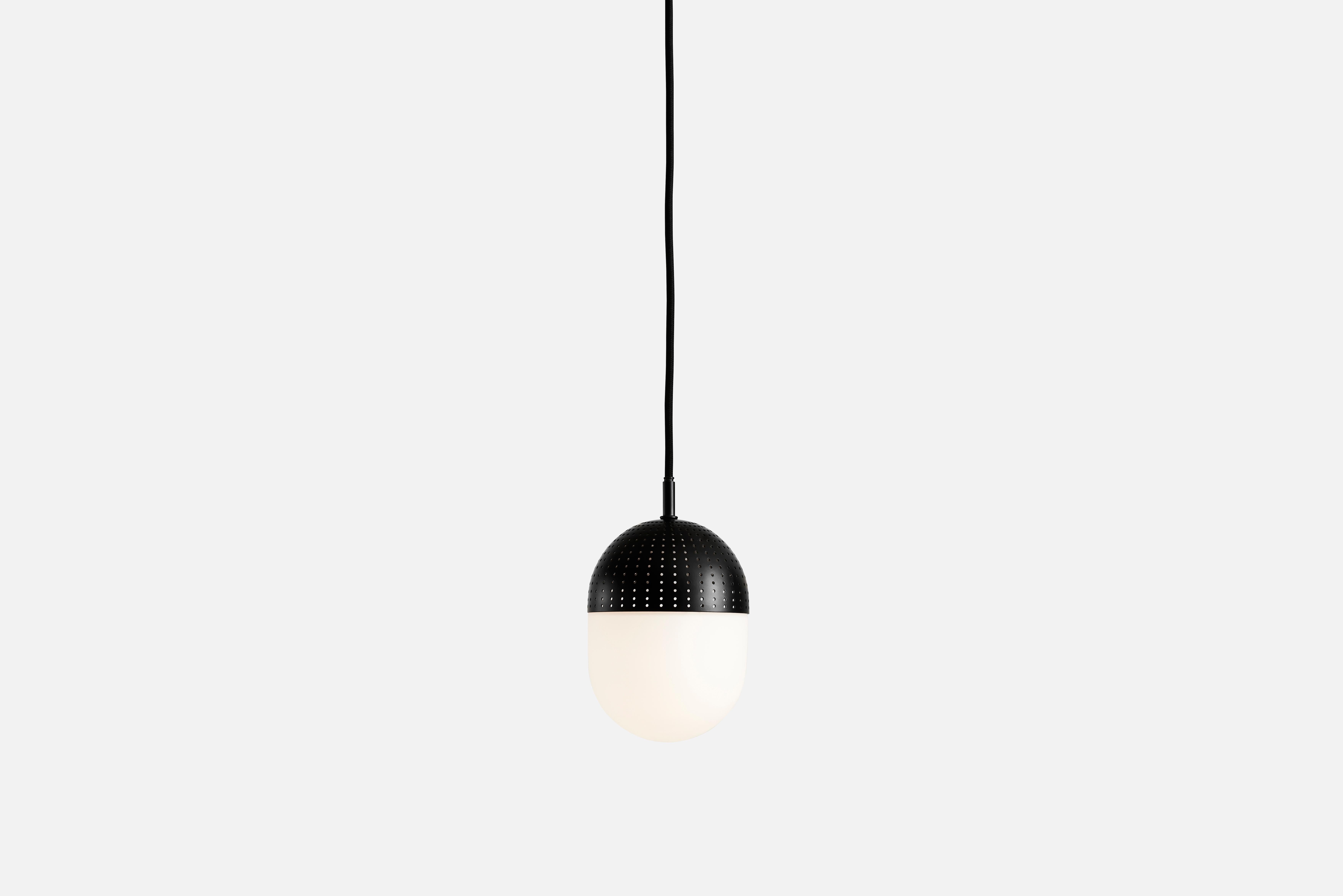 Medium black dot pendant lamp by Rikke Frost.
Materials: metal, glass.
Dimensions: D 14 x H 16.6 cm.
Available in black or satin and in 3 sizes: H 13, H 16.6, H 21 cm.

Rikke Frost is a Danish graduate from the School of Architecture Aarhus.