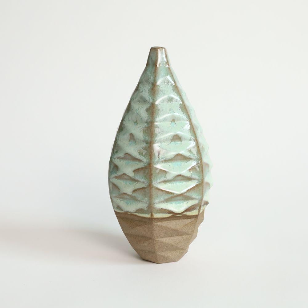 Medium Bottle in Coral Green
The Medium Bottle is a unique and captivating piece of ceramic art that is sure to elevate any space. Its wide waistline and small opening create the perfect canvas for a single or few dried flowers, making it an ideal