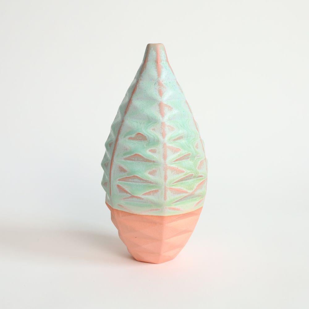 Medium Bottle in Strawberry Pistachio
The Medium Bottle is a unique and captivating piece of ceramic art that is sure to elevate any space. Its wide waistline and small opening create the perfect canvas for a single or few dried flowers, making it