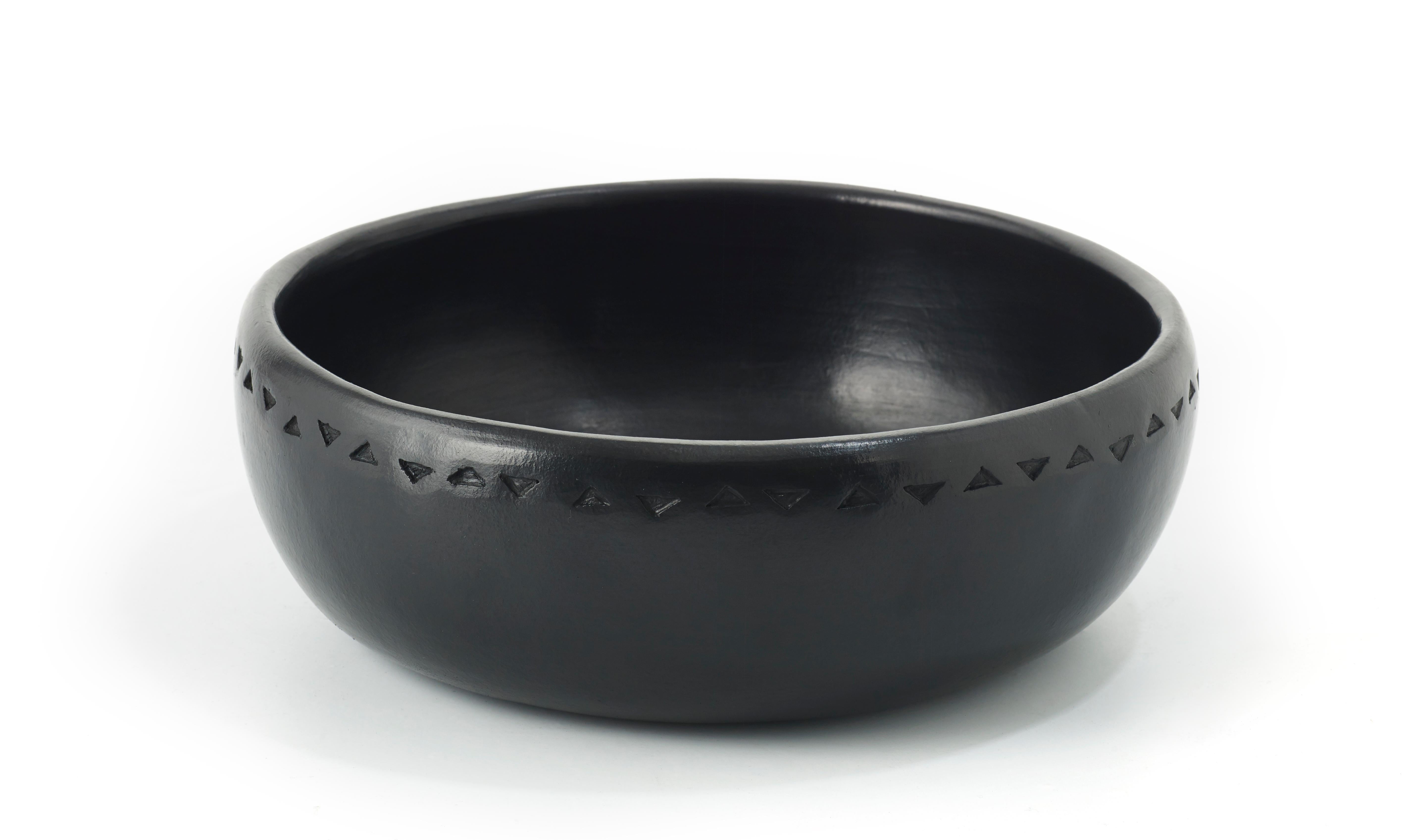 Medium bowl Barro dining by Sebastian Herkner
Materials: heat-resistant black ceramic. 
Technique: glazed. Oven cooked and polished with semi-precious stones. 
Dimensions: diameter 31 cm x height 11 cm 
Available in sizes: Large, small, and X